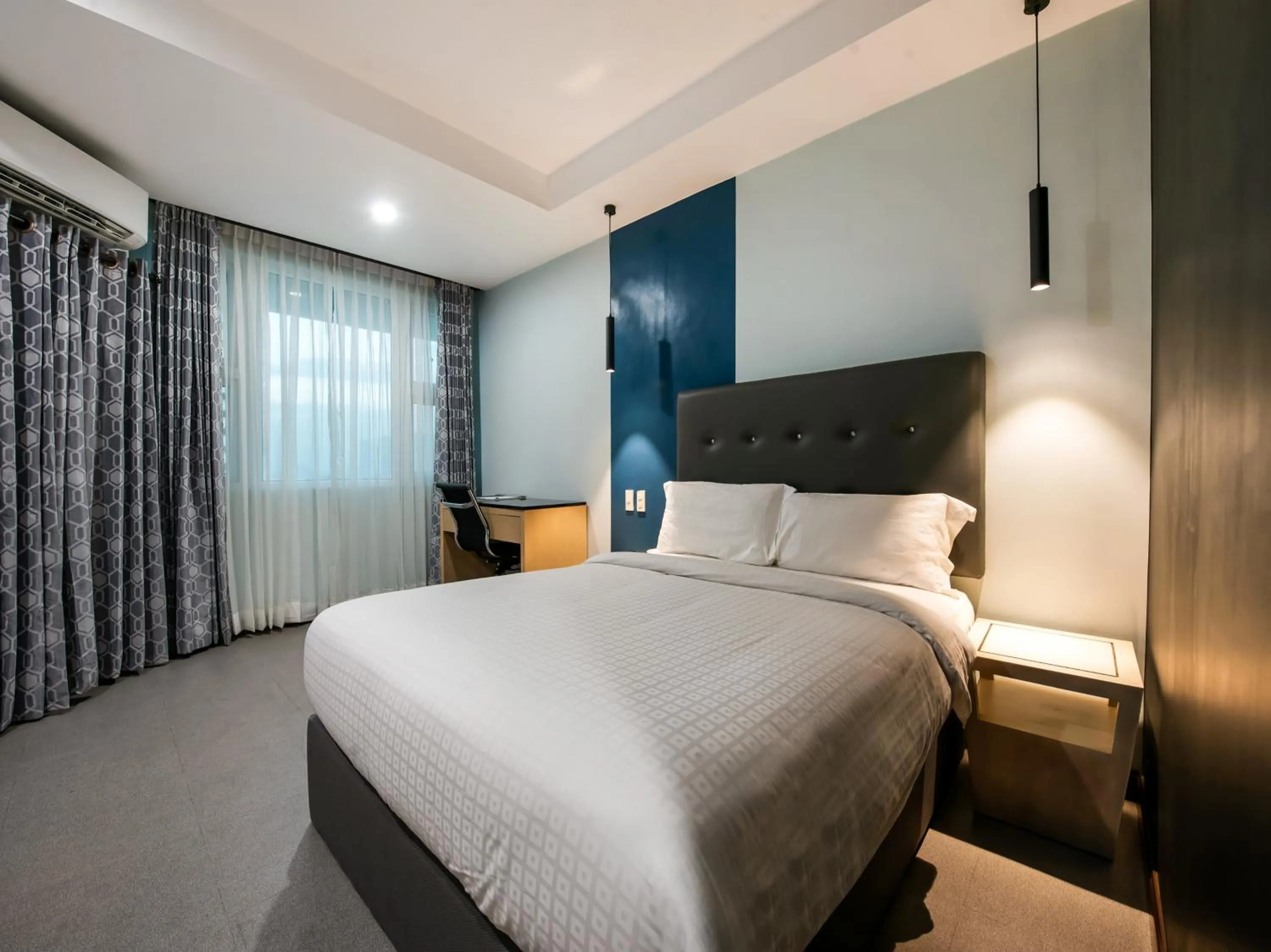 Bed in Bay Area Suites Manila