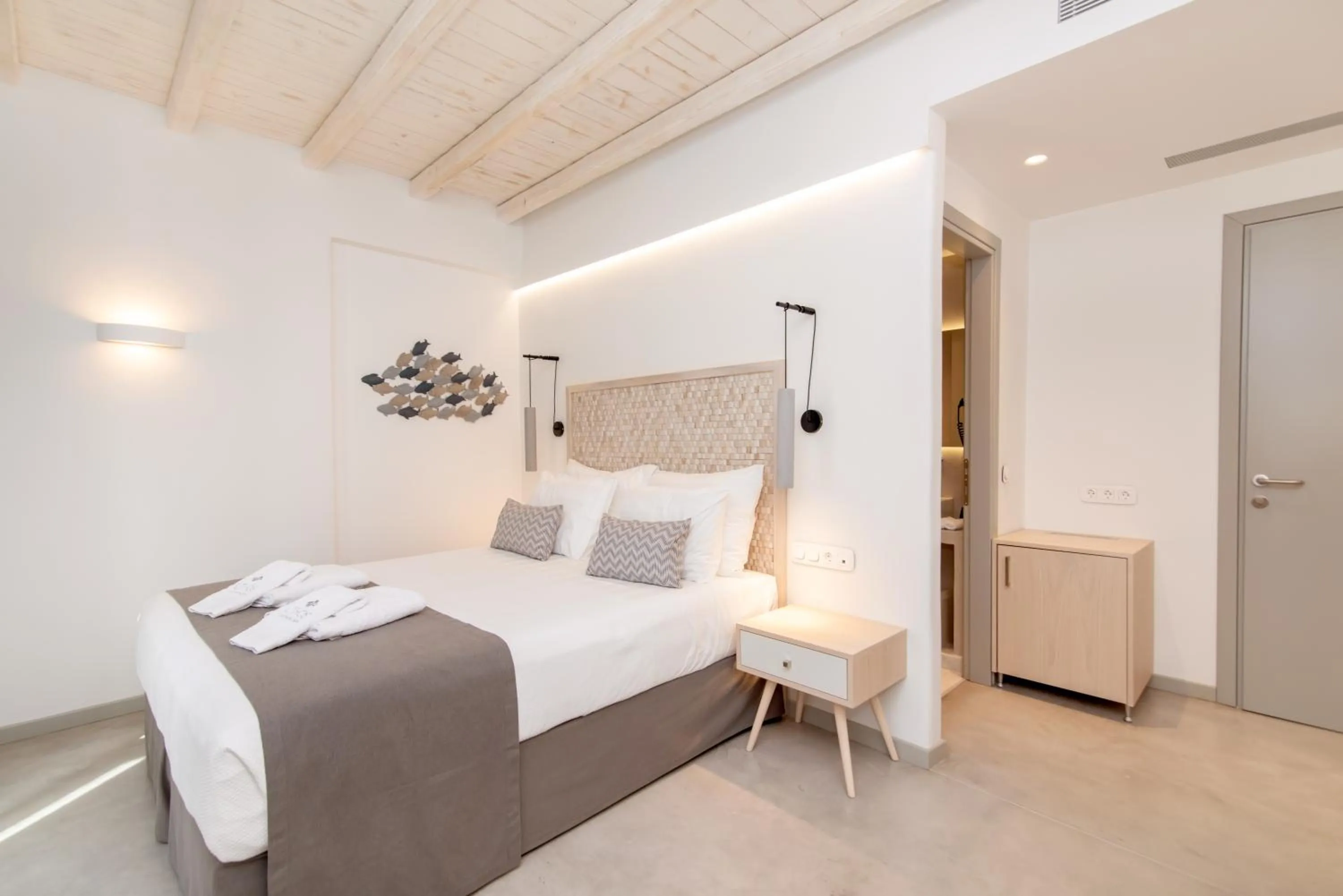 Bed in Lithos Luxury Suites