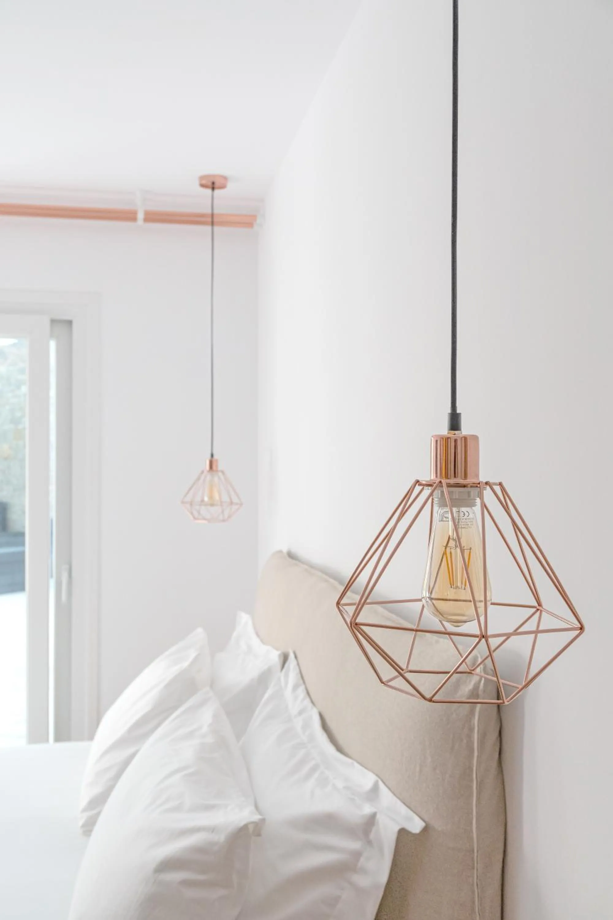 Bed in Omnia Mykonos Boutique Hotel & Suites