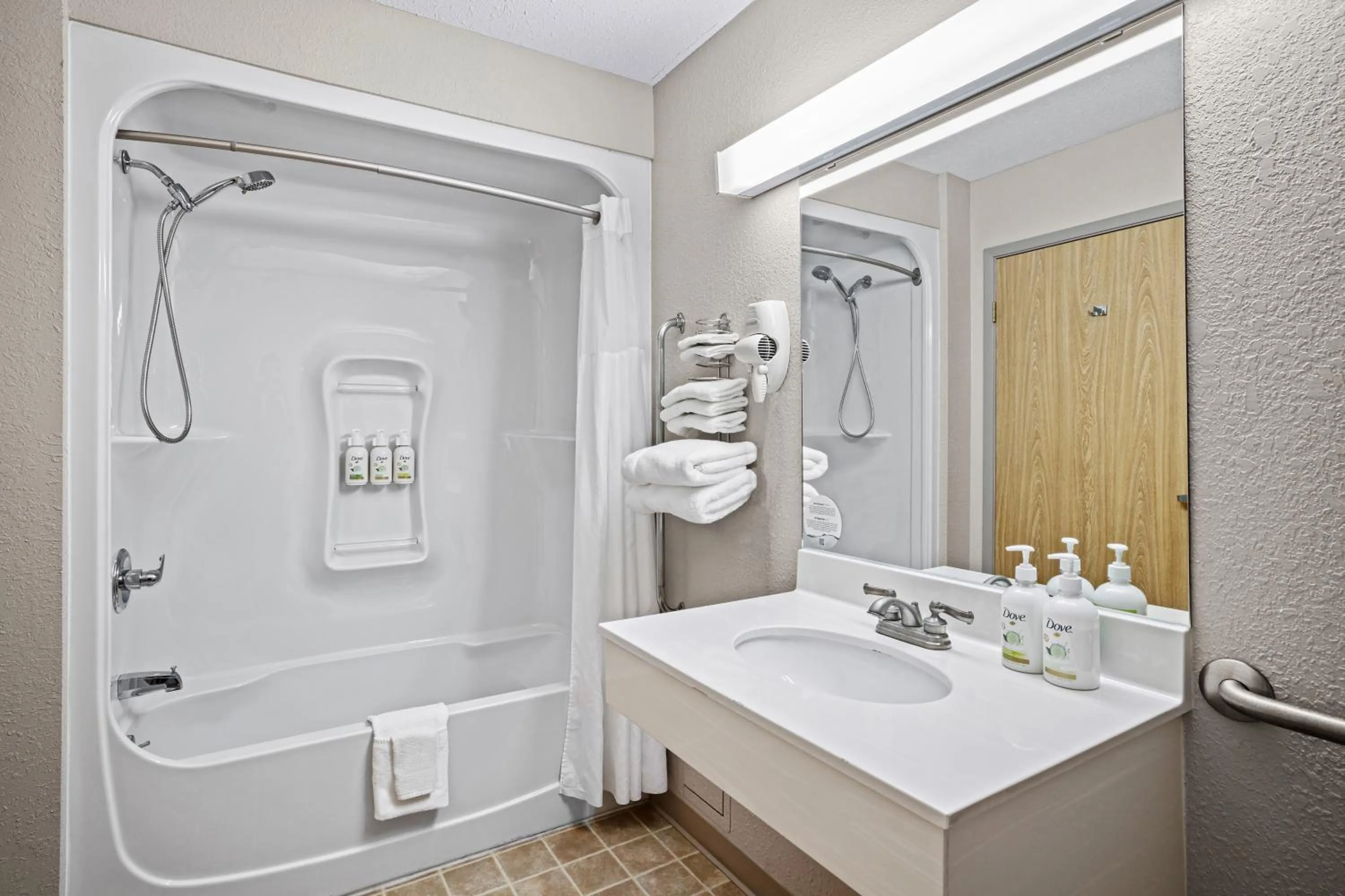 Bathroom in Days Inn & Suites by Wyndham Winkler