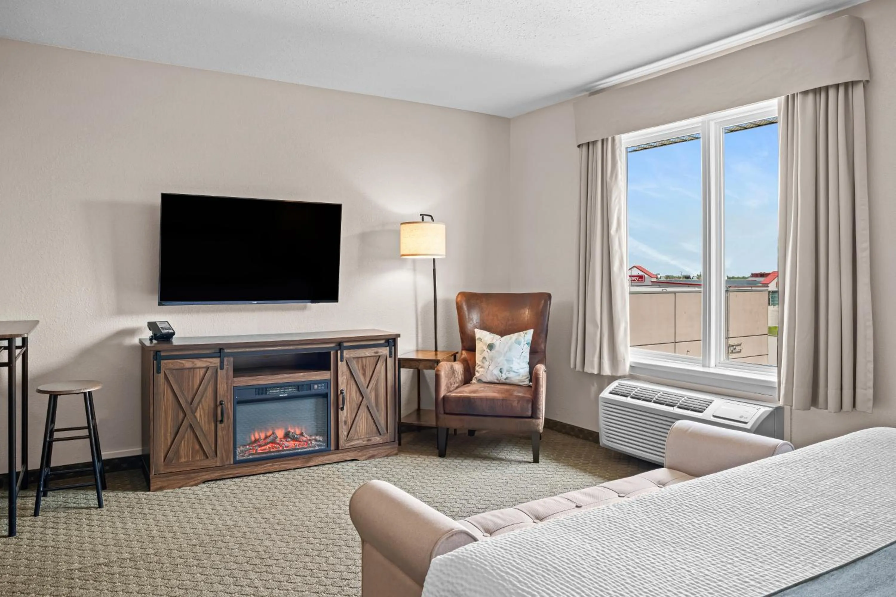 Seating area, Bed in Days Inn & Suites by Wyndham Winkler