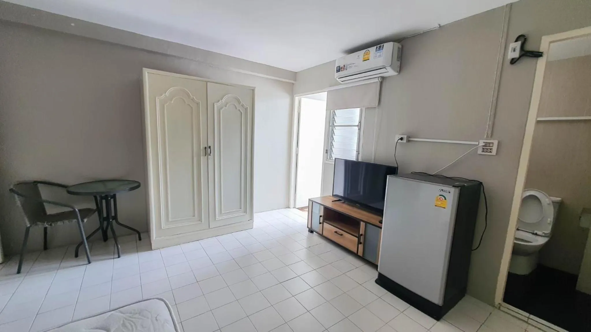 Bedroom in RoomQuest Bangkok Ratchada