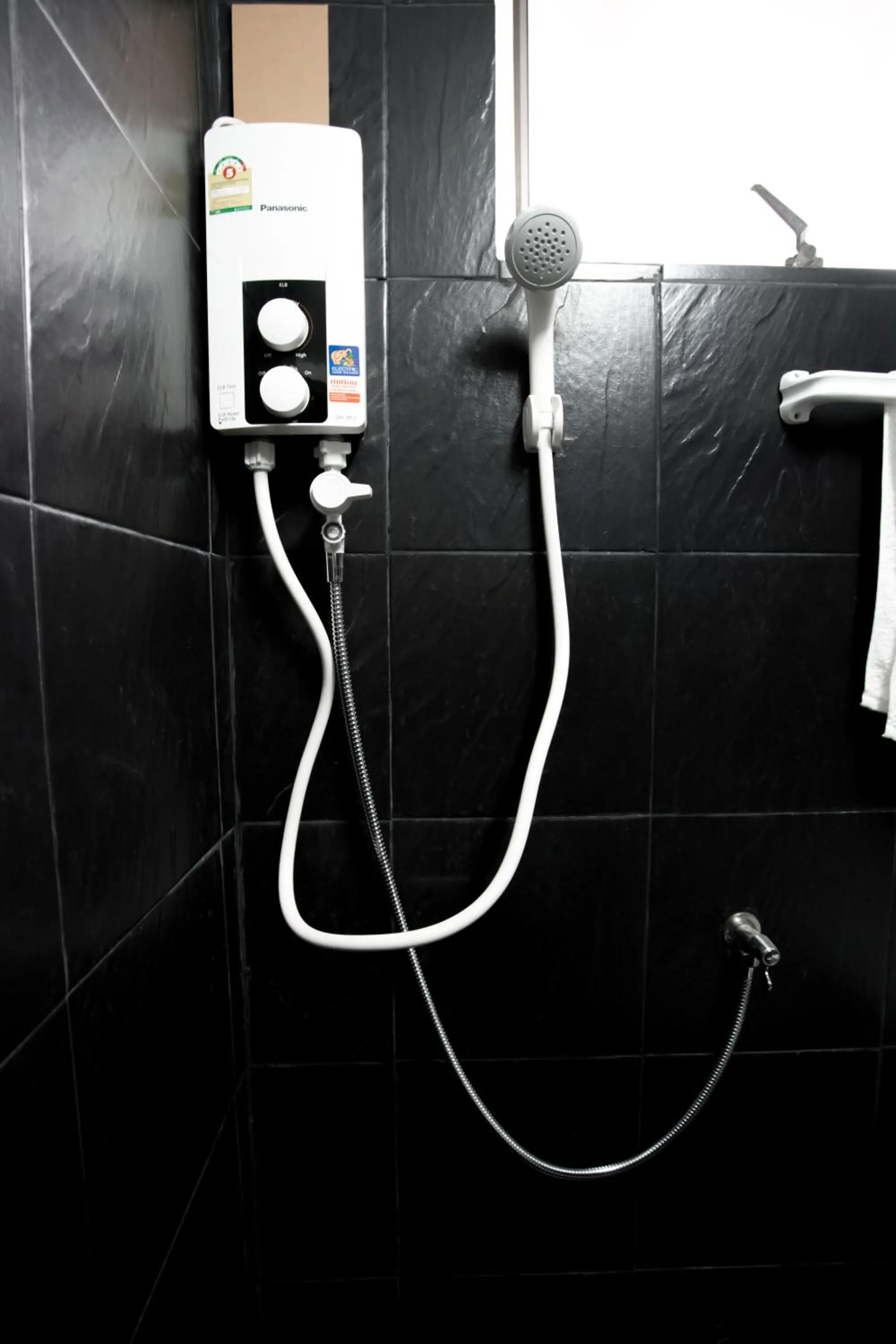 Bathroom in RoomQuest Bangkok Ratchada