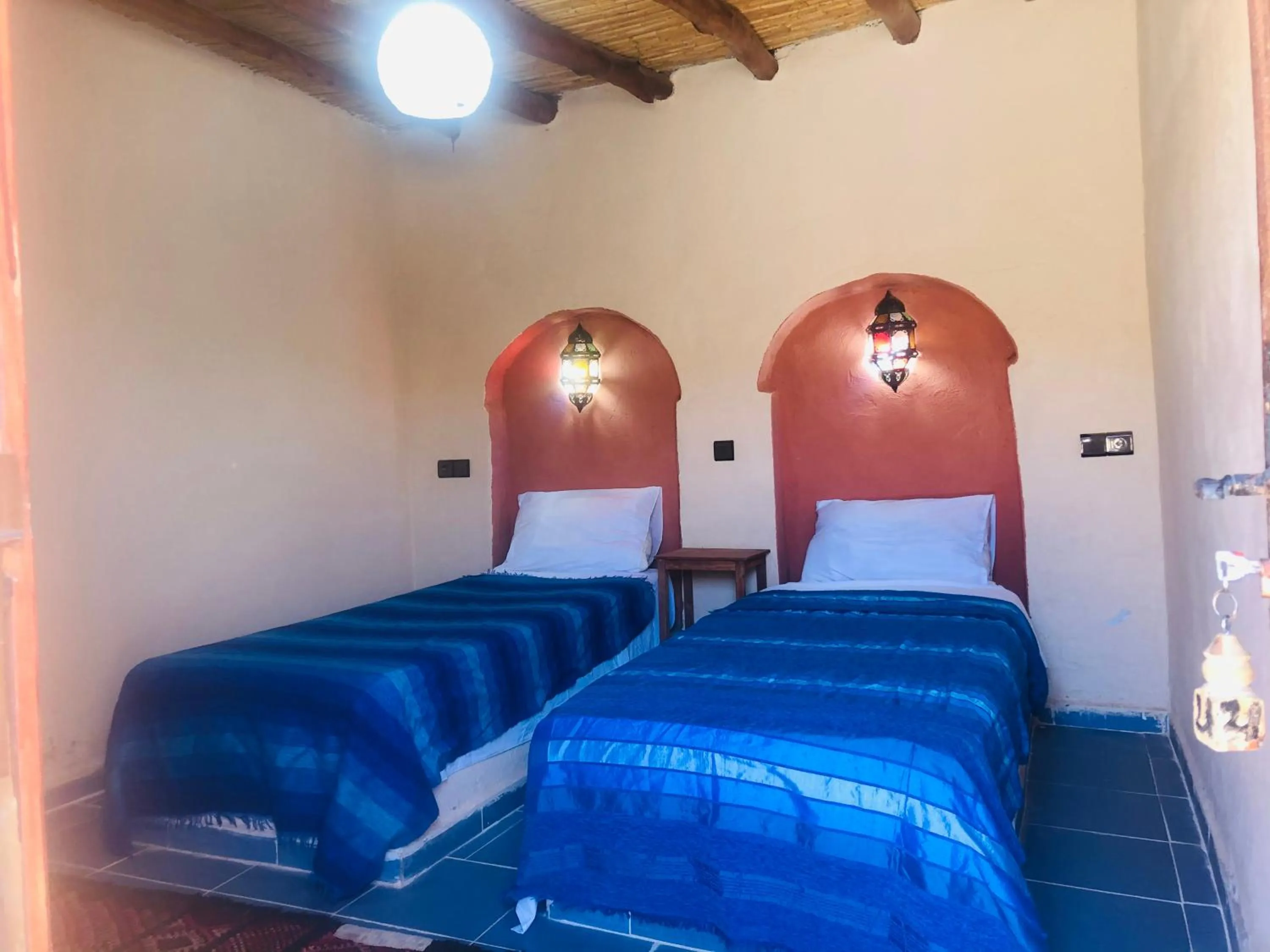 Bed in Riad Hotel Les Flamants