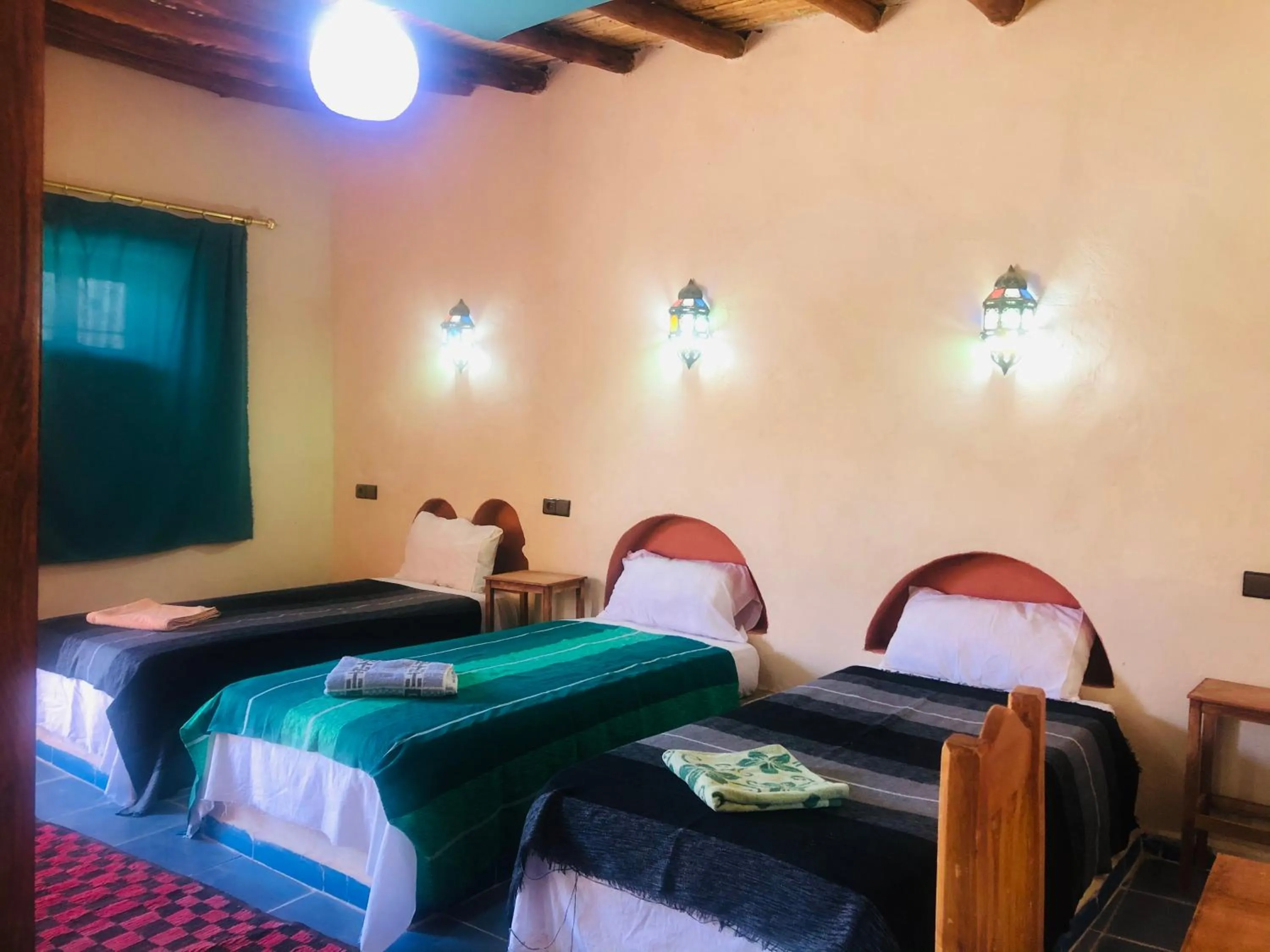 Bed in Riad Hotel Les Flamants