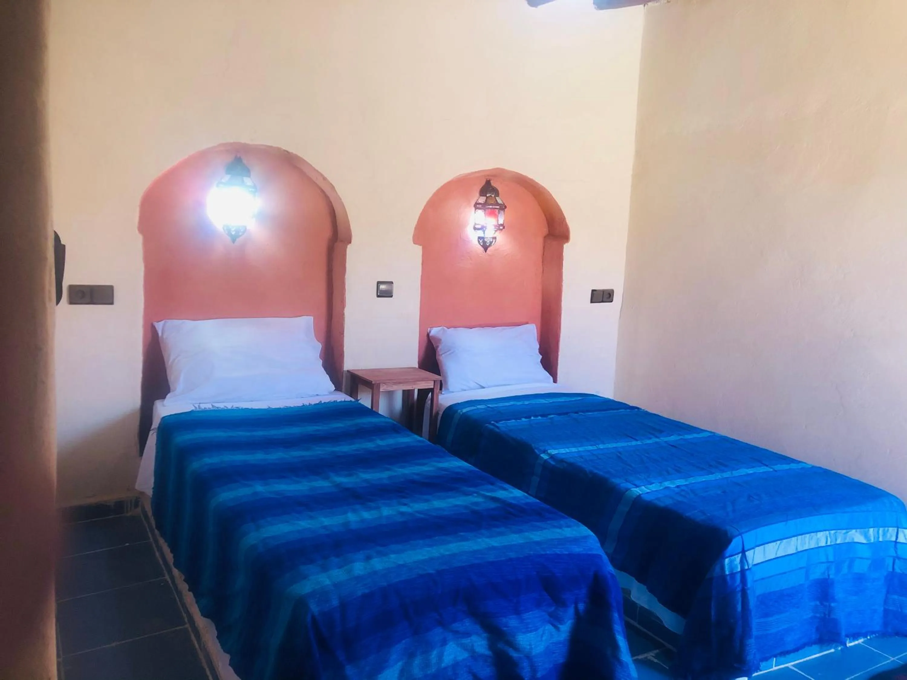 Bed in Riad Hotel Les Flamants