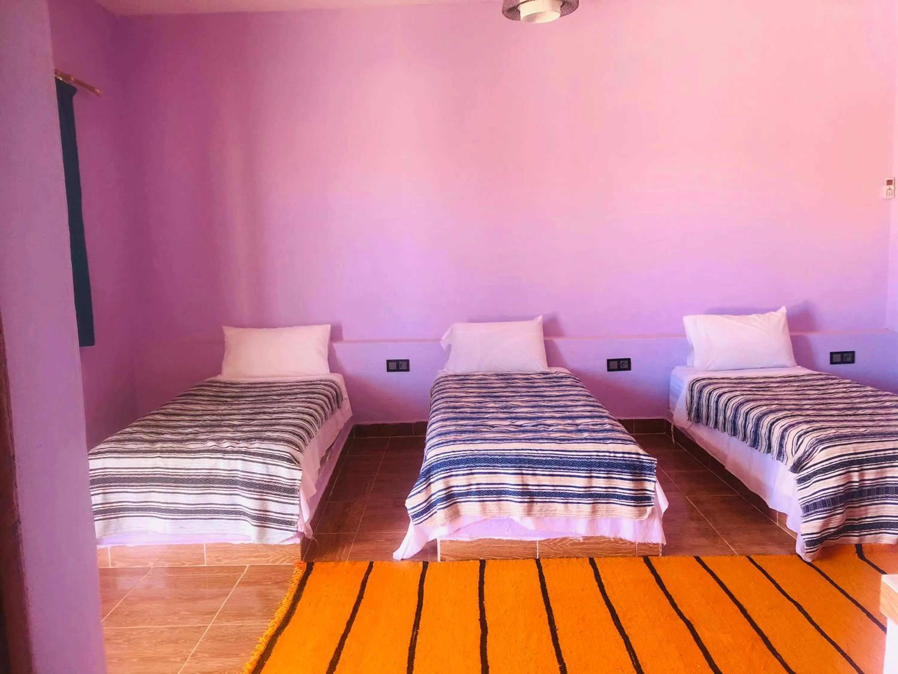 Bed in Riad Hotel Les Flamants