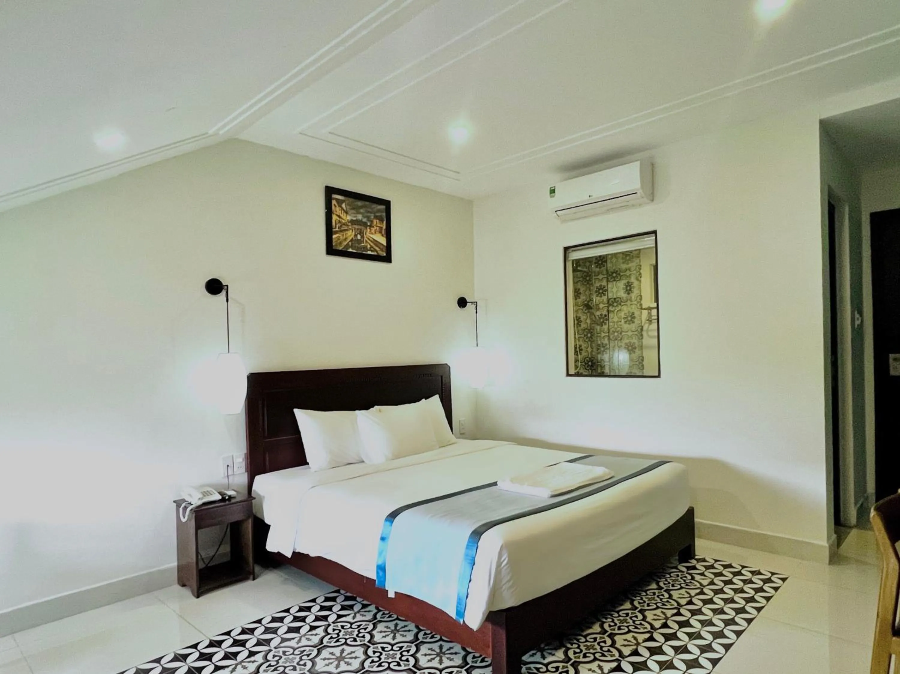 Bed in Grand Holiday Hoian Villa