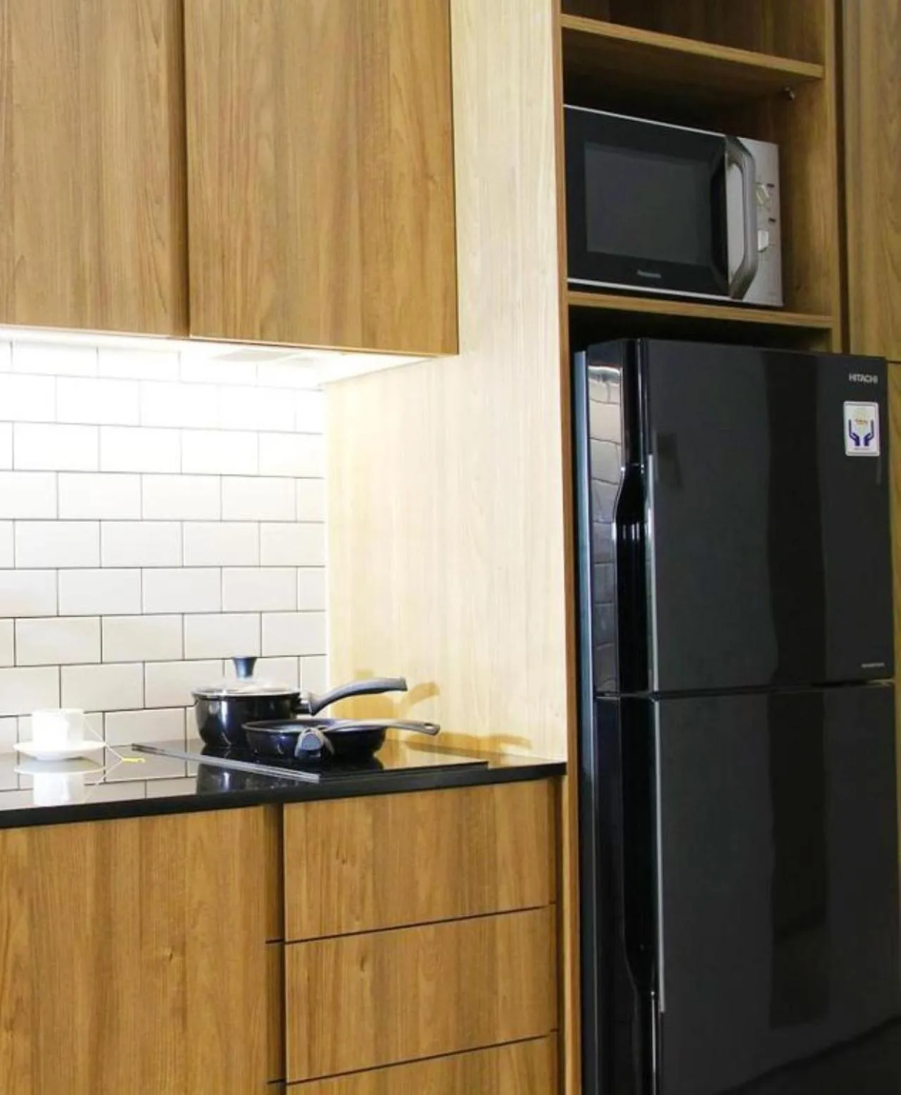 Kitchen or kitchenette in Nagomi Suites & Hotel