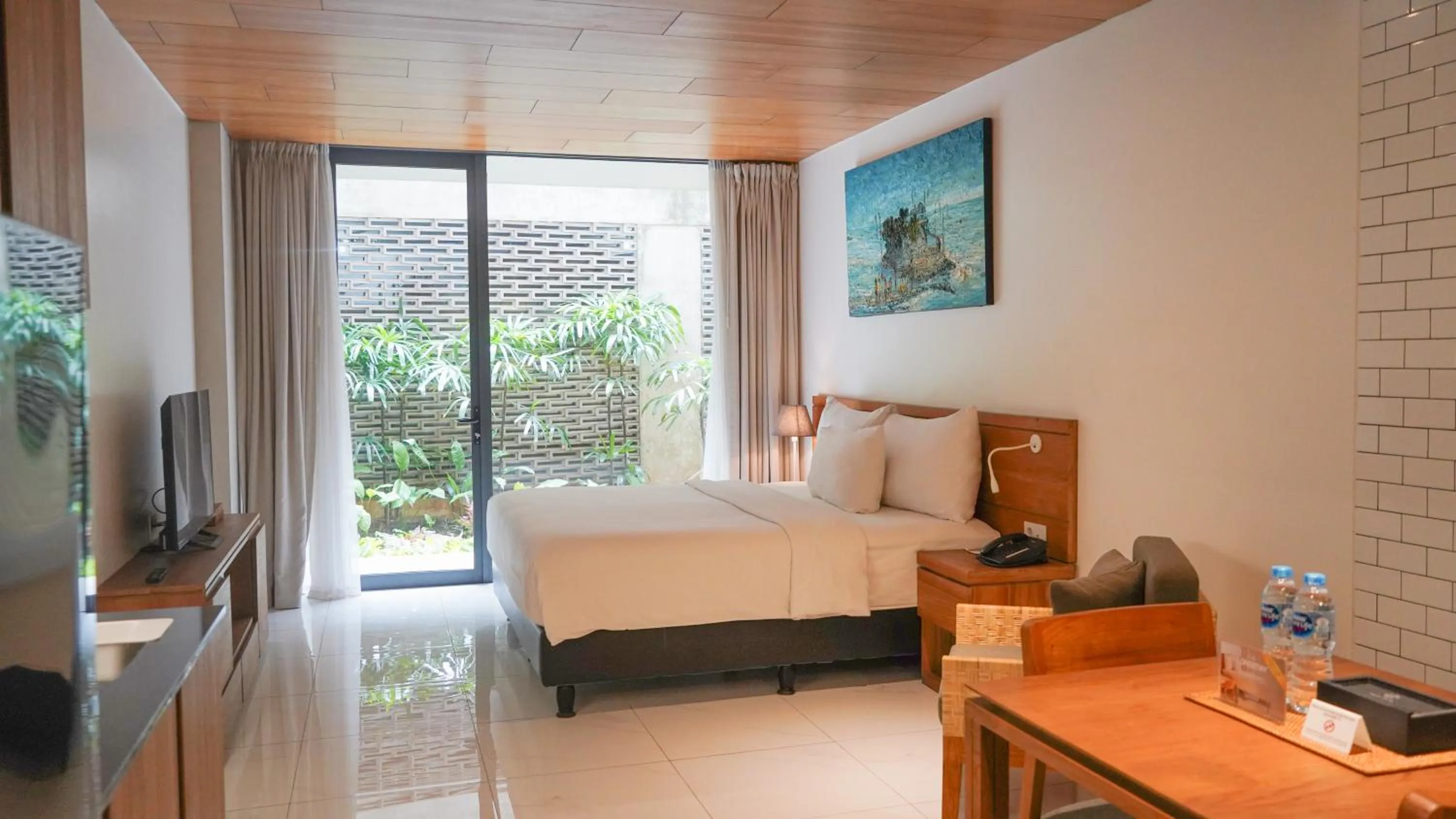 Bed in Nagomi Suites & Hotel