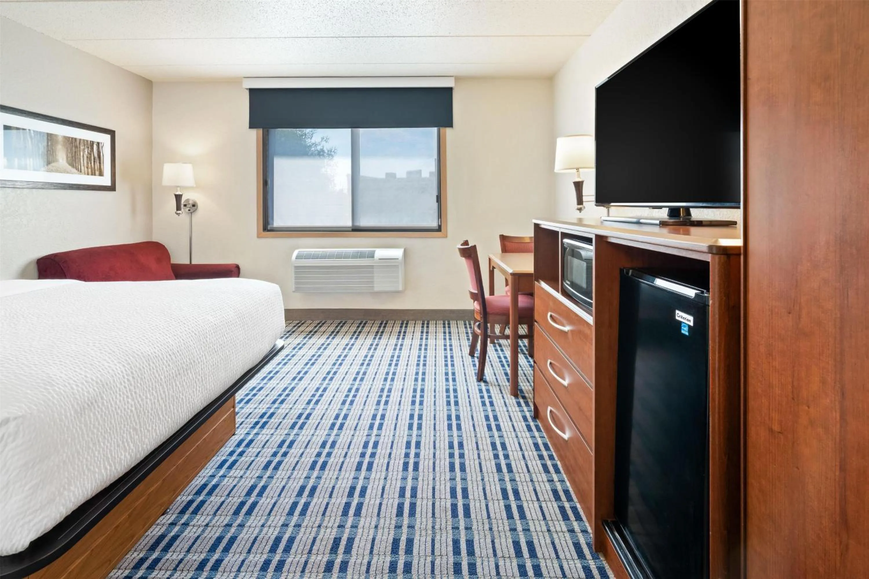 Photo of the whole room, Bed in AmericInn by Wyndham Dickinson