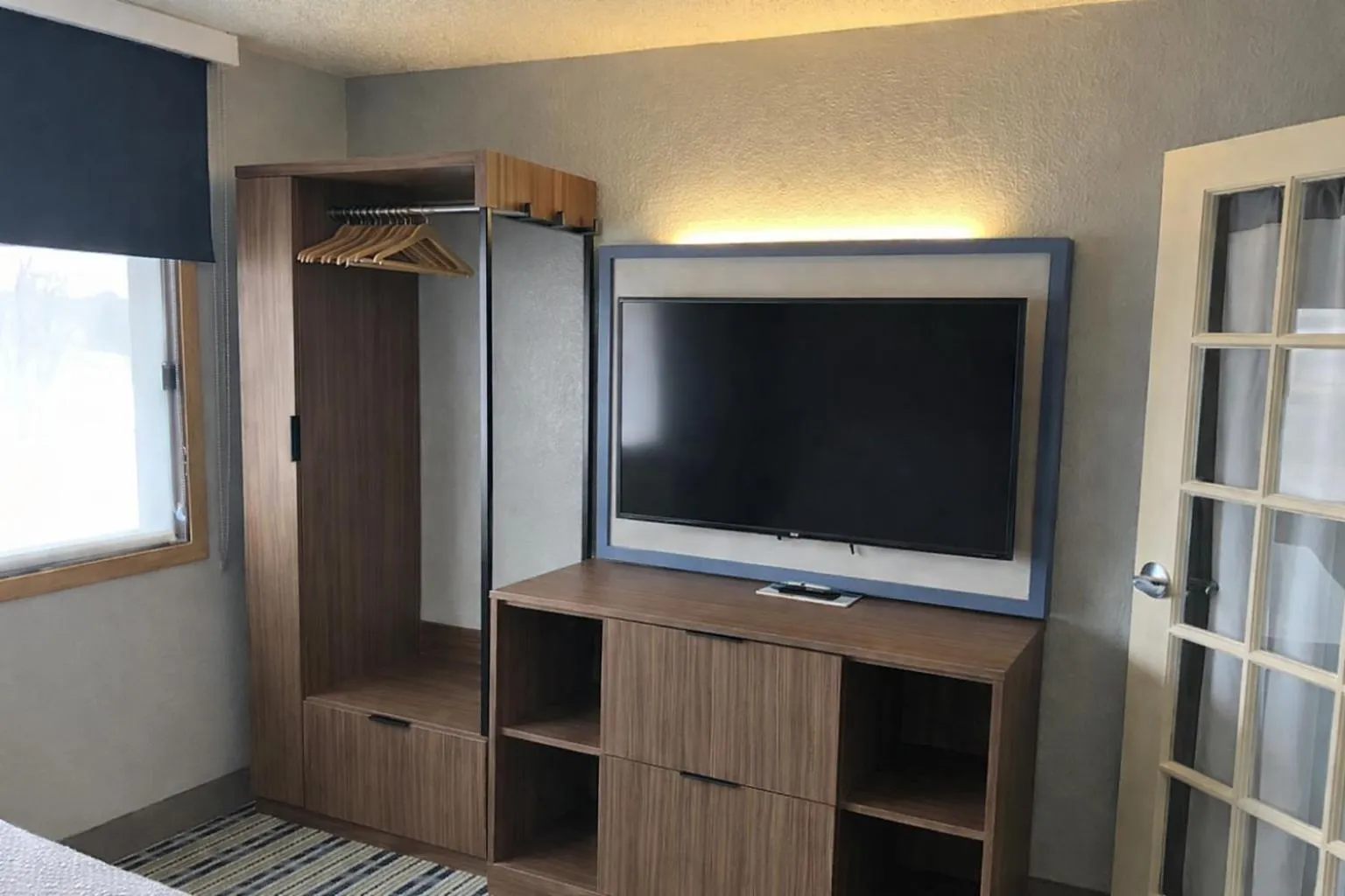 Bedroom in AmericInn by Wyndham Dickinson