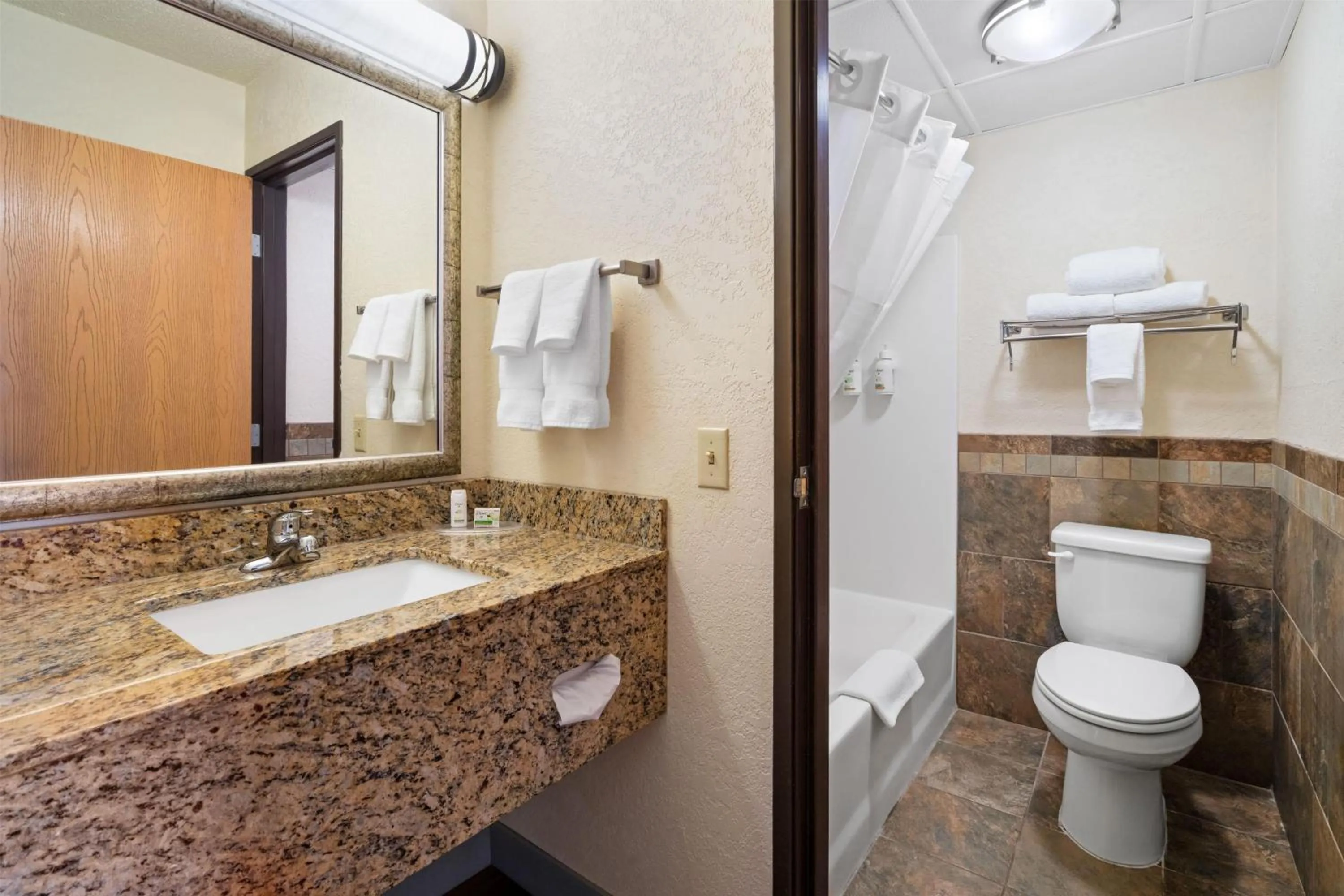 Bathroom in AmericInn by Wyndham Dickinson