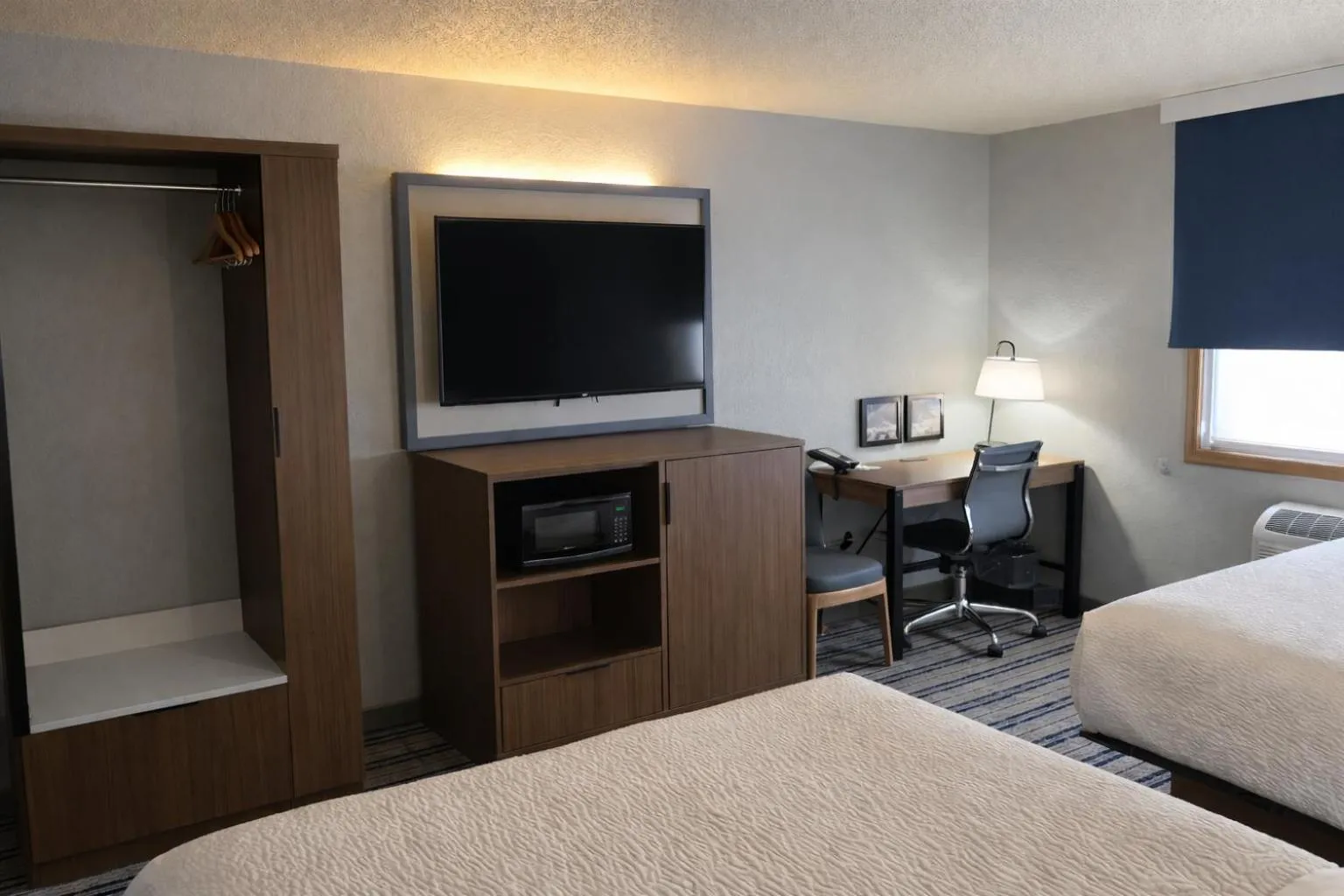 Photo of the whole room, Bed in AmericInn by Wyndham Dickinson