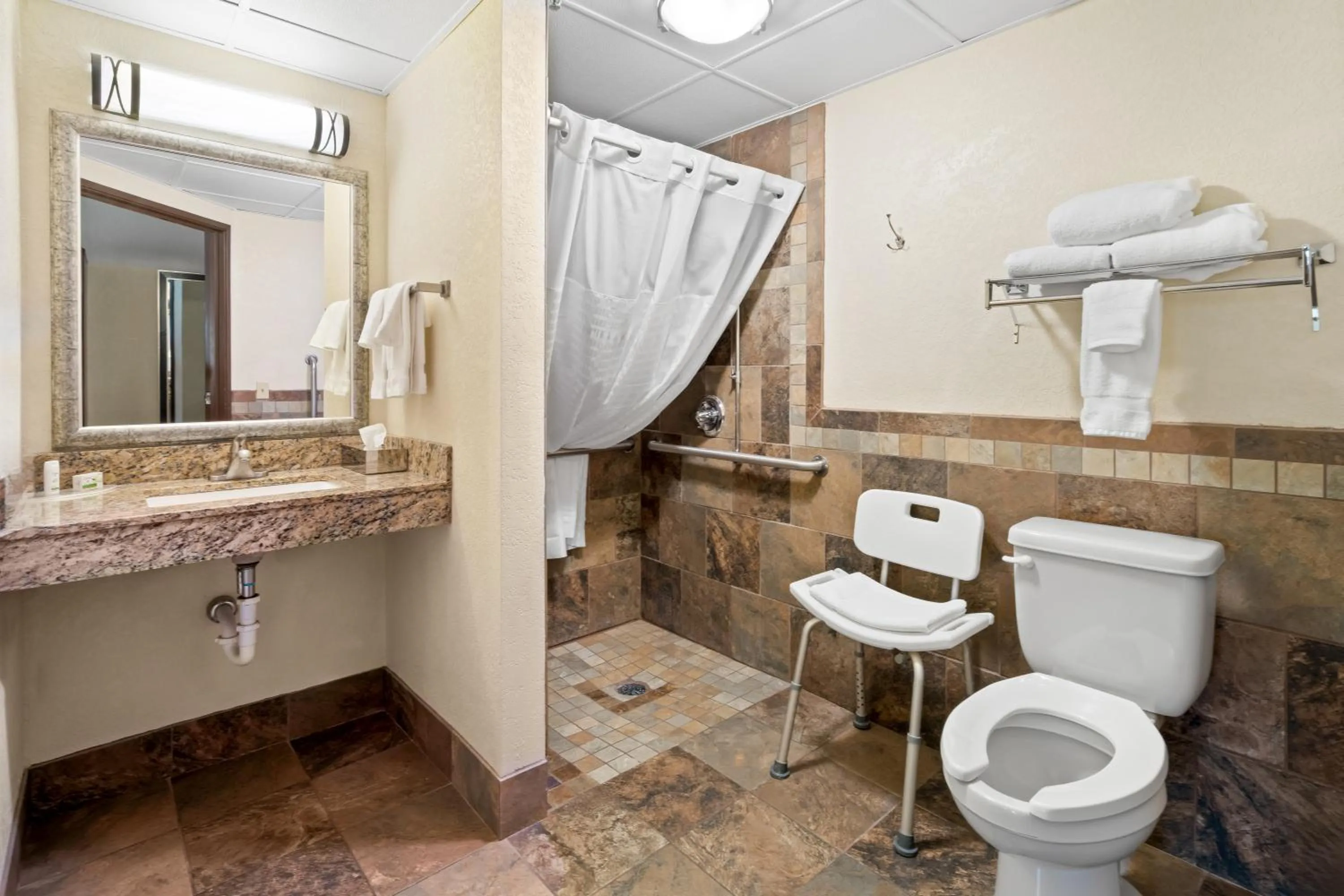 Bathroom in AmericInn by Wyndham Dickinson