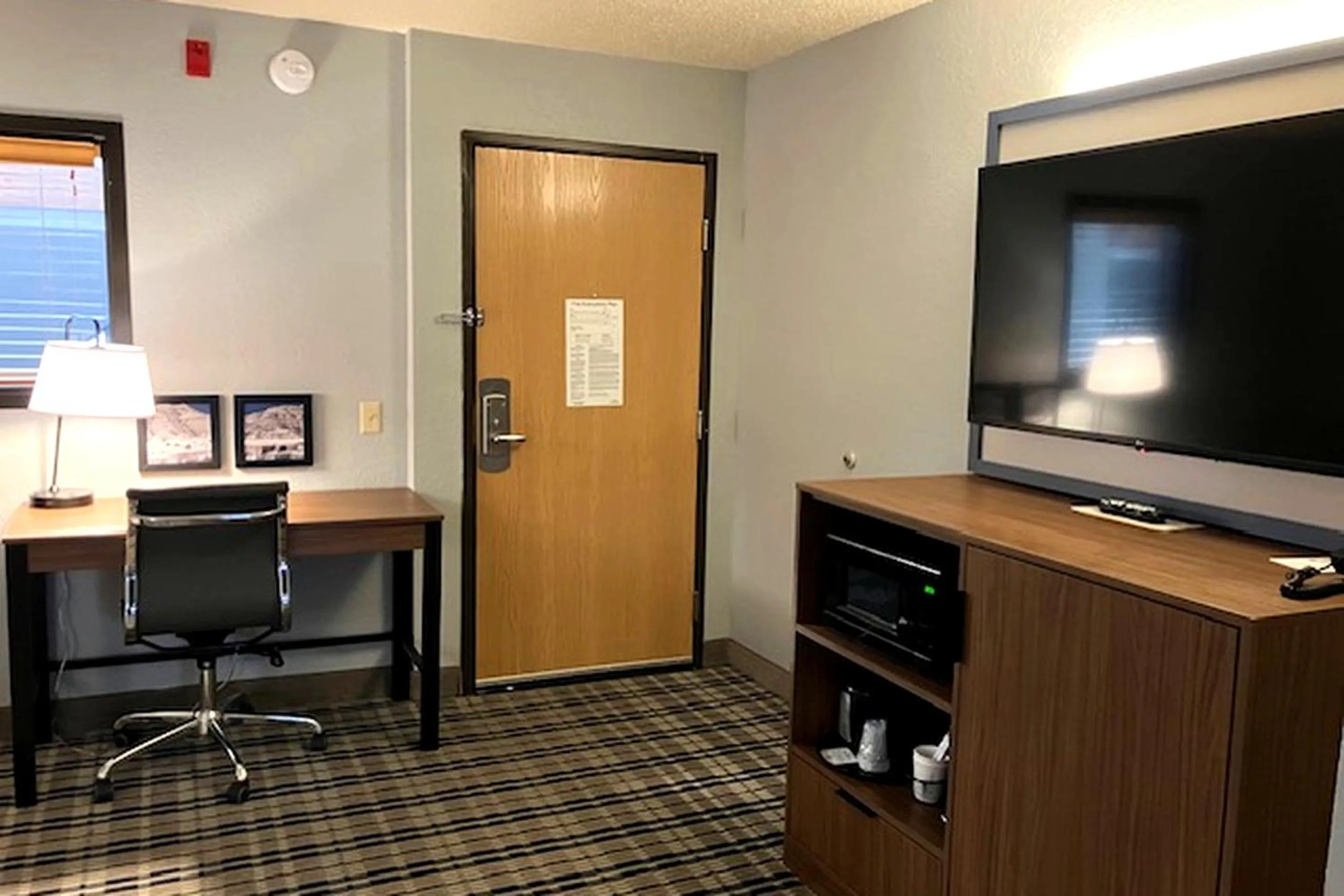 Living room in AmericInn by Wyndham Dickinson