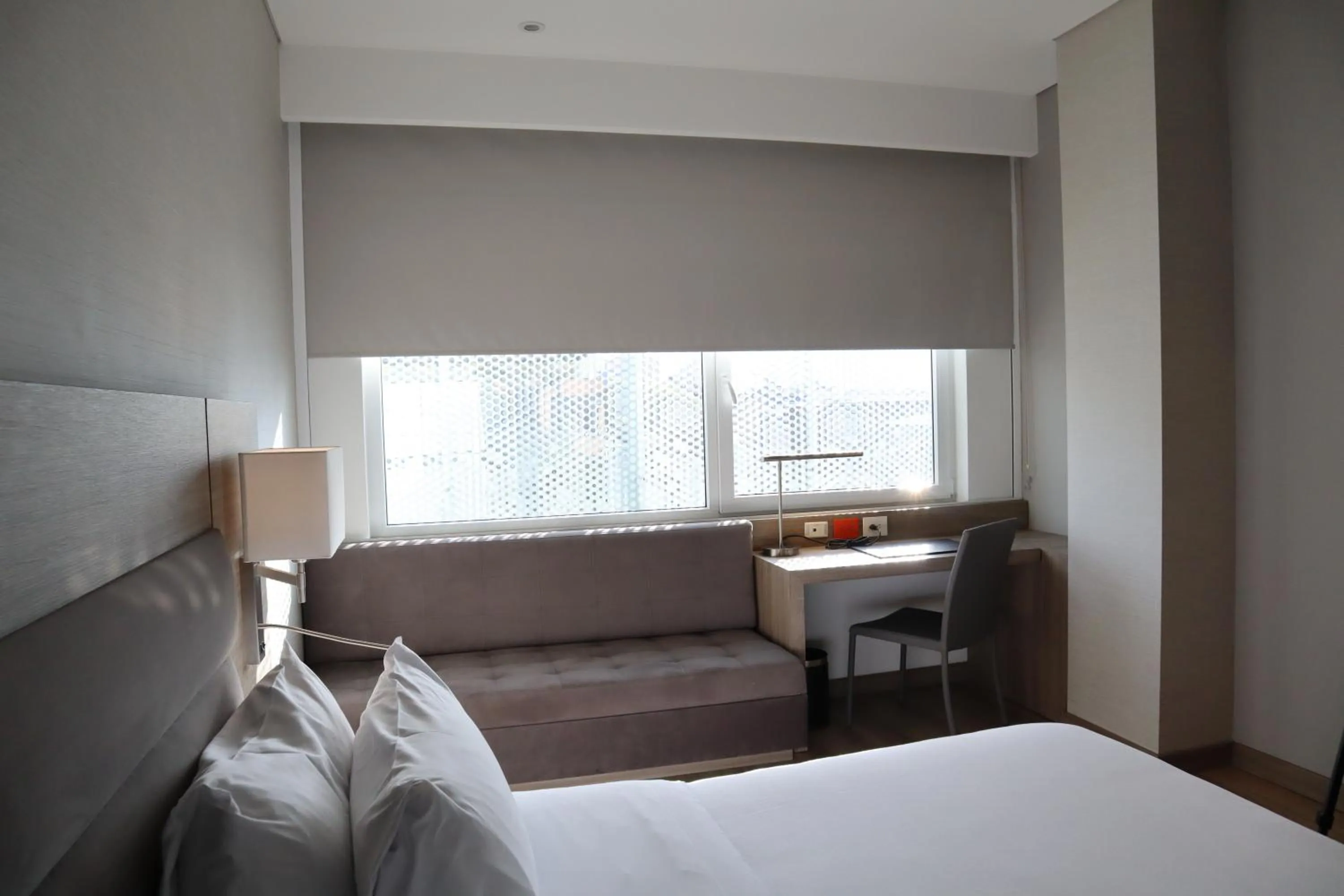 Seating area, Bed in AC Hotel by Marriott Bogota Zona T