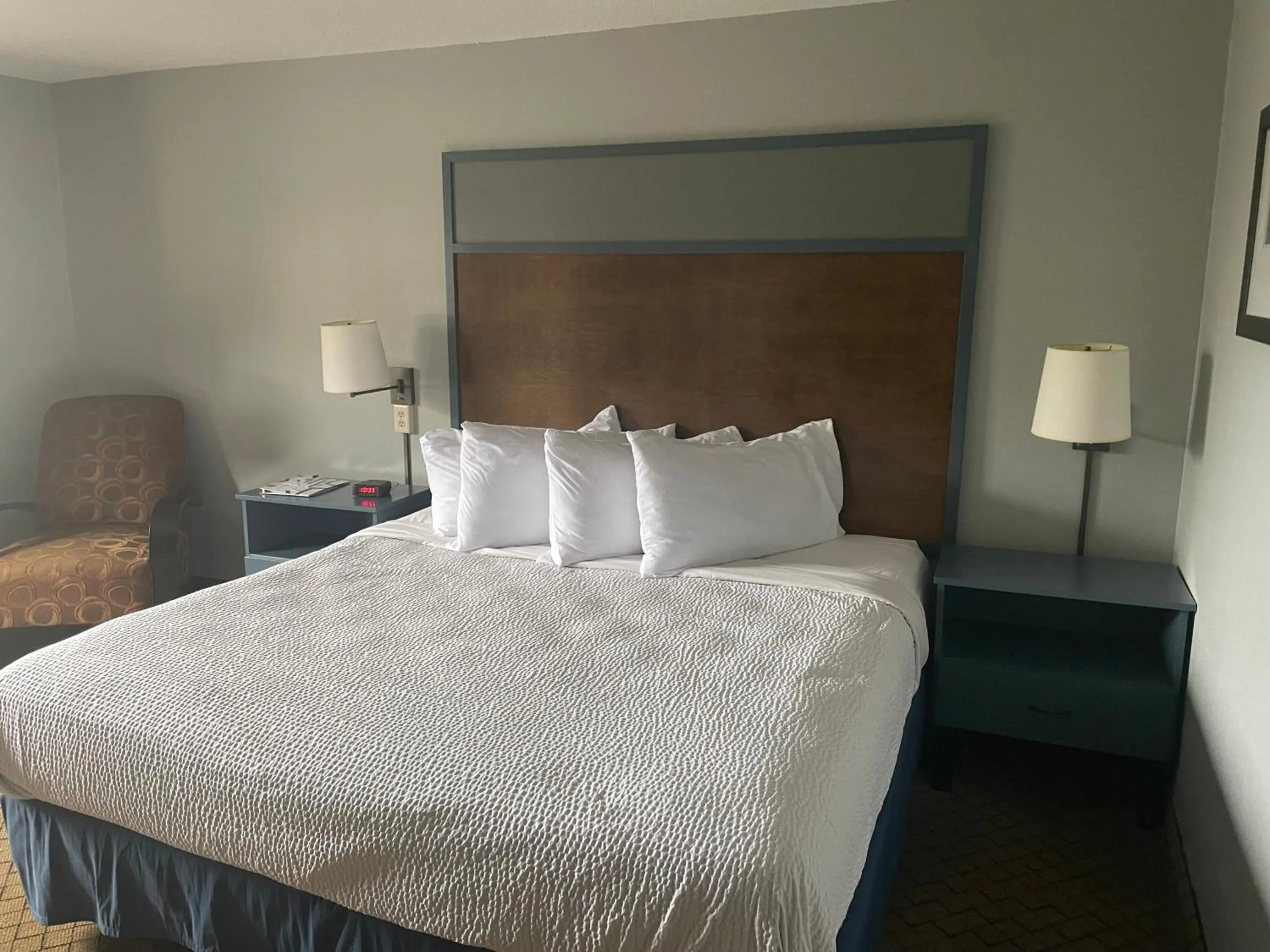 Bed in AmericInn by Wyndham Hartford WI