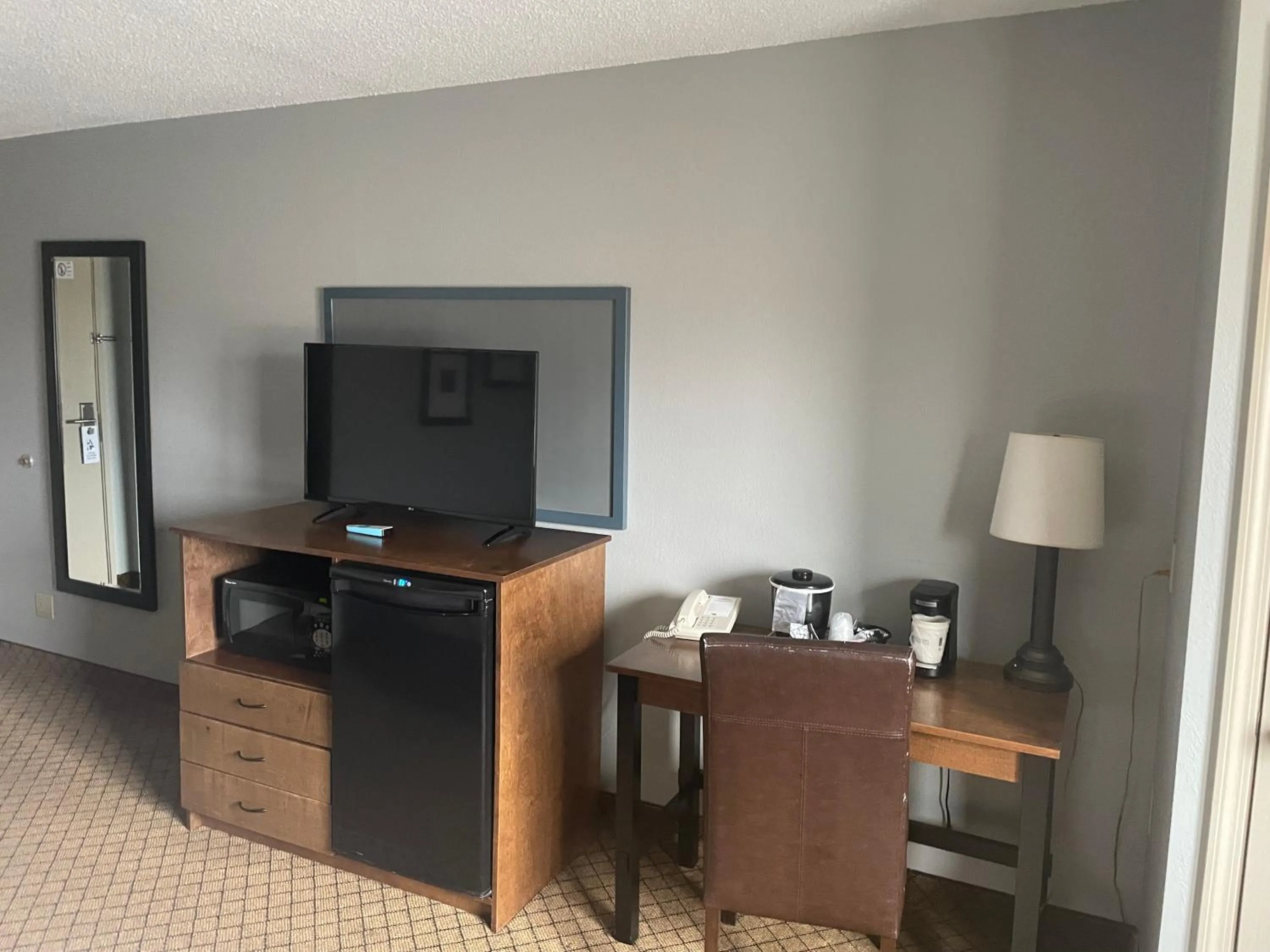 TV and multimedia in AmericInn by Wyndham Hartford WI