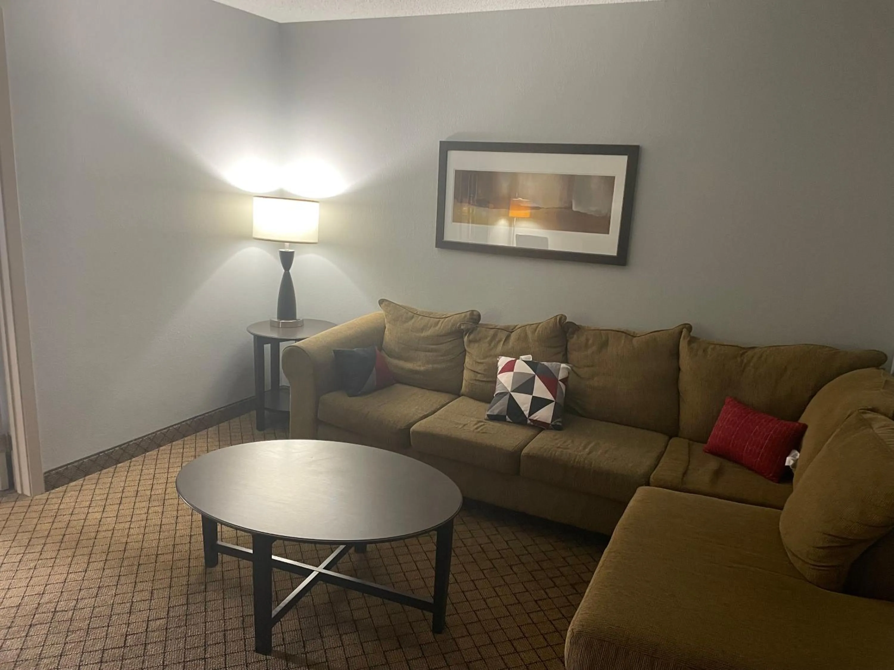 Living room in AmericInn by Wyndham Hartford WI