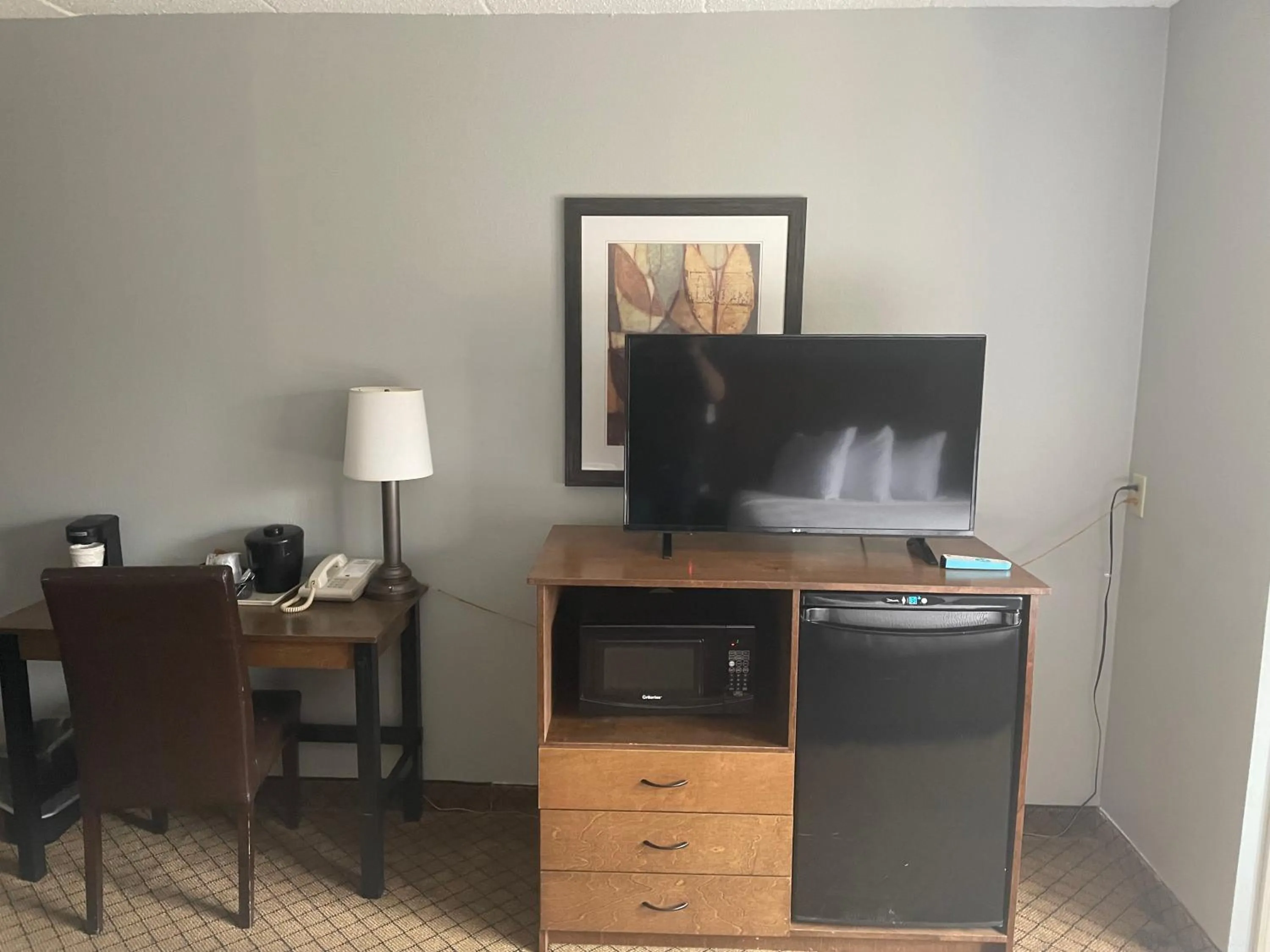 TV and multimedia in AmericInn by Wyndham Hartford WI