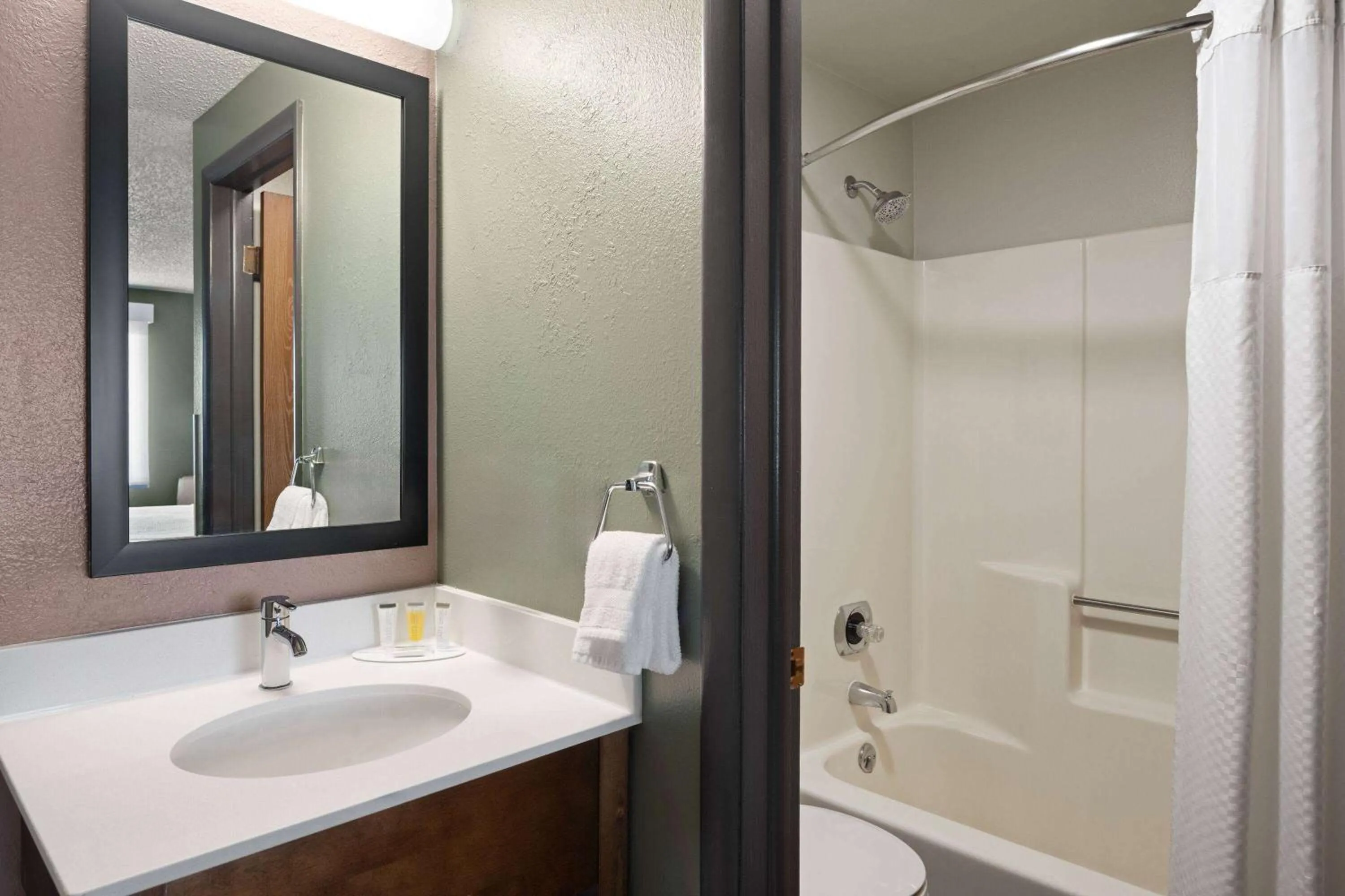 Bathroom in Super 8 by Wyndham Conrad