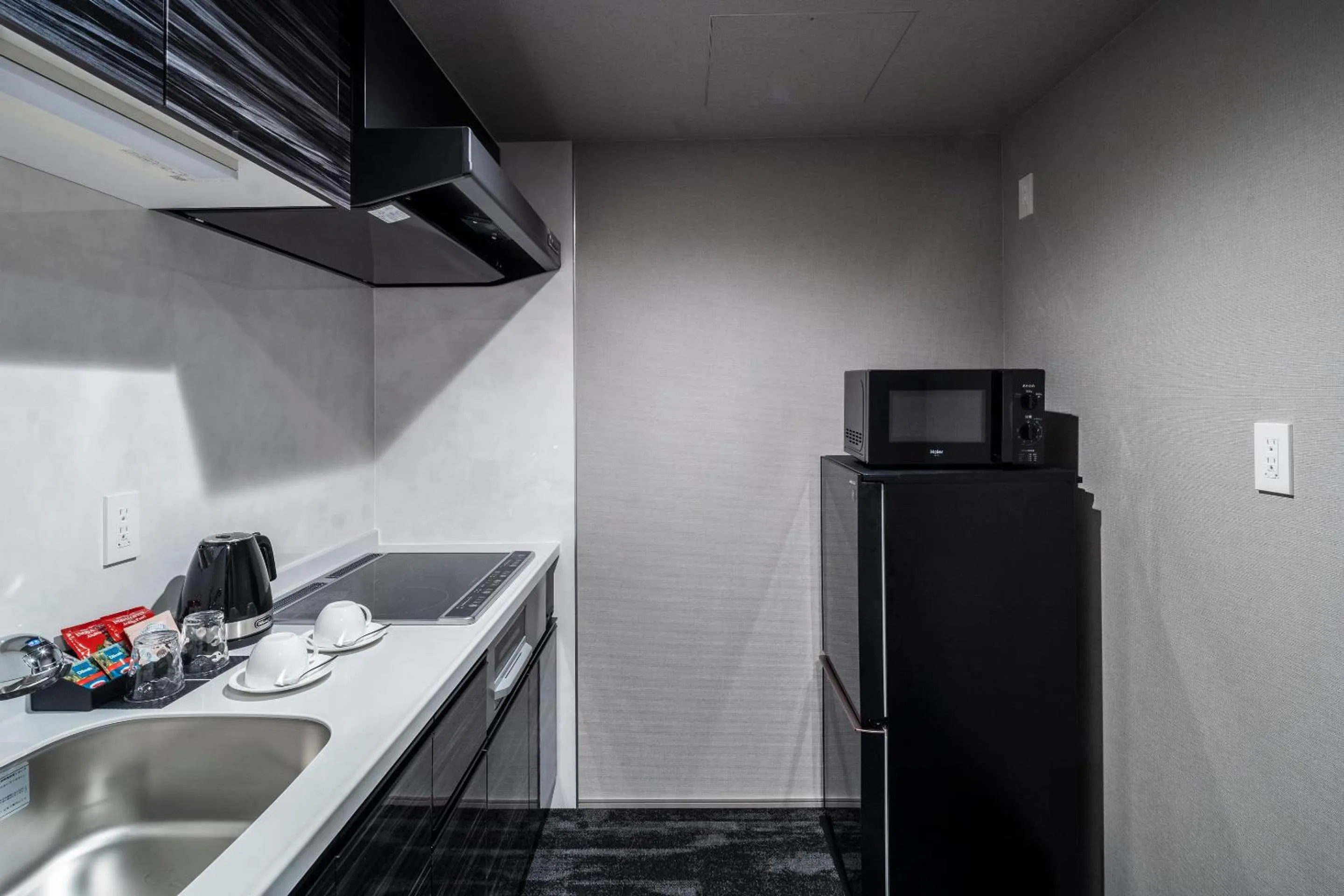 Kitchen or kitchenette in RESI STAY Mayu Grace Hotel