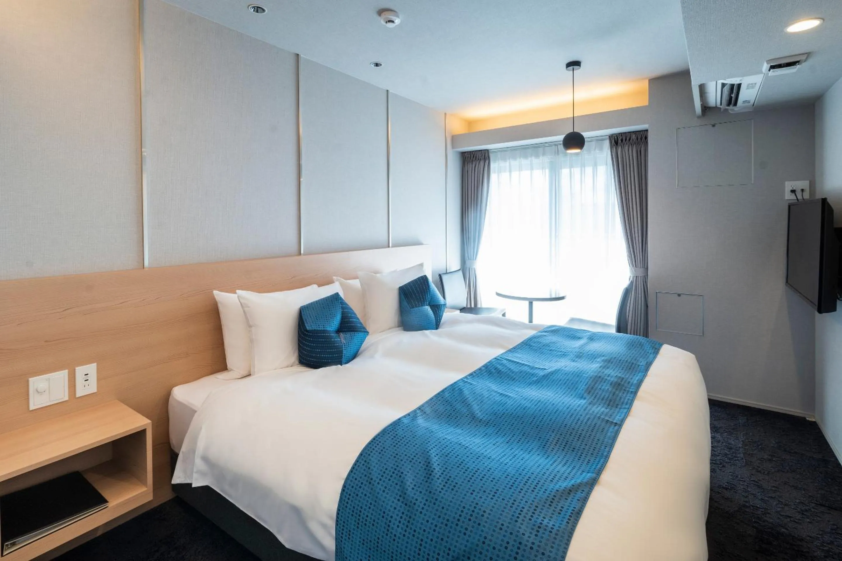 Bed in RESI STAY Mayu Grace Hotel