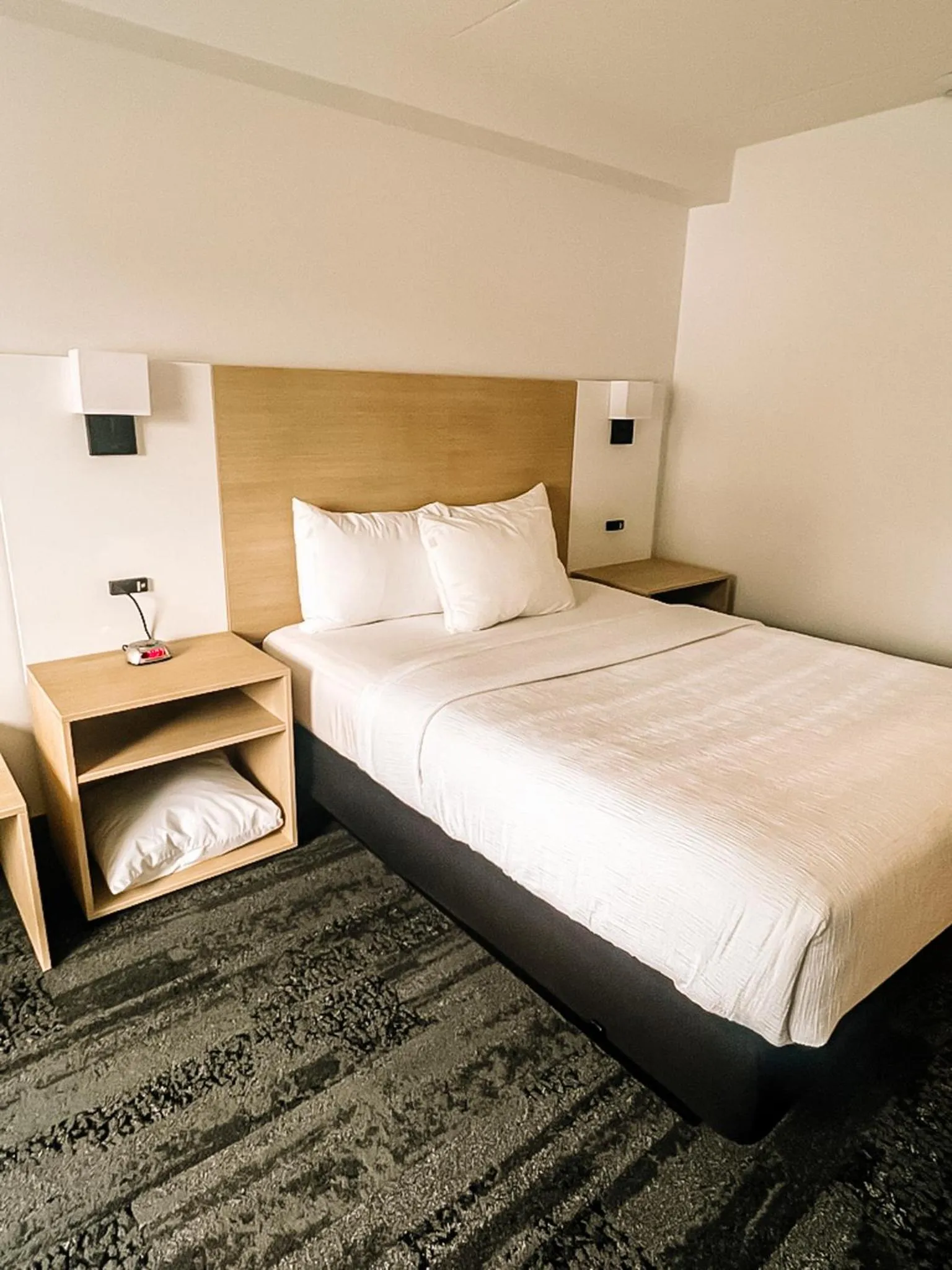 Bed in La Place Rendez-Vous Hotel