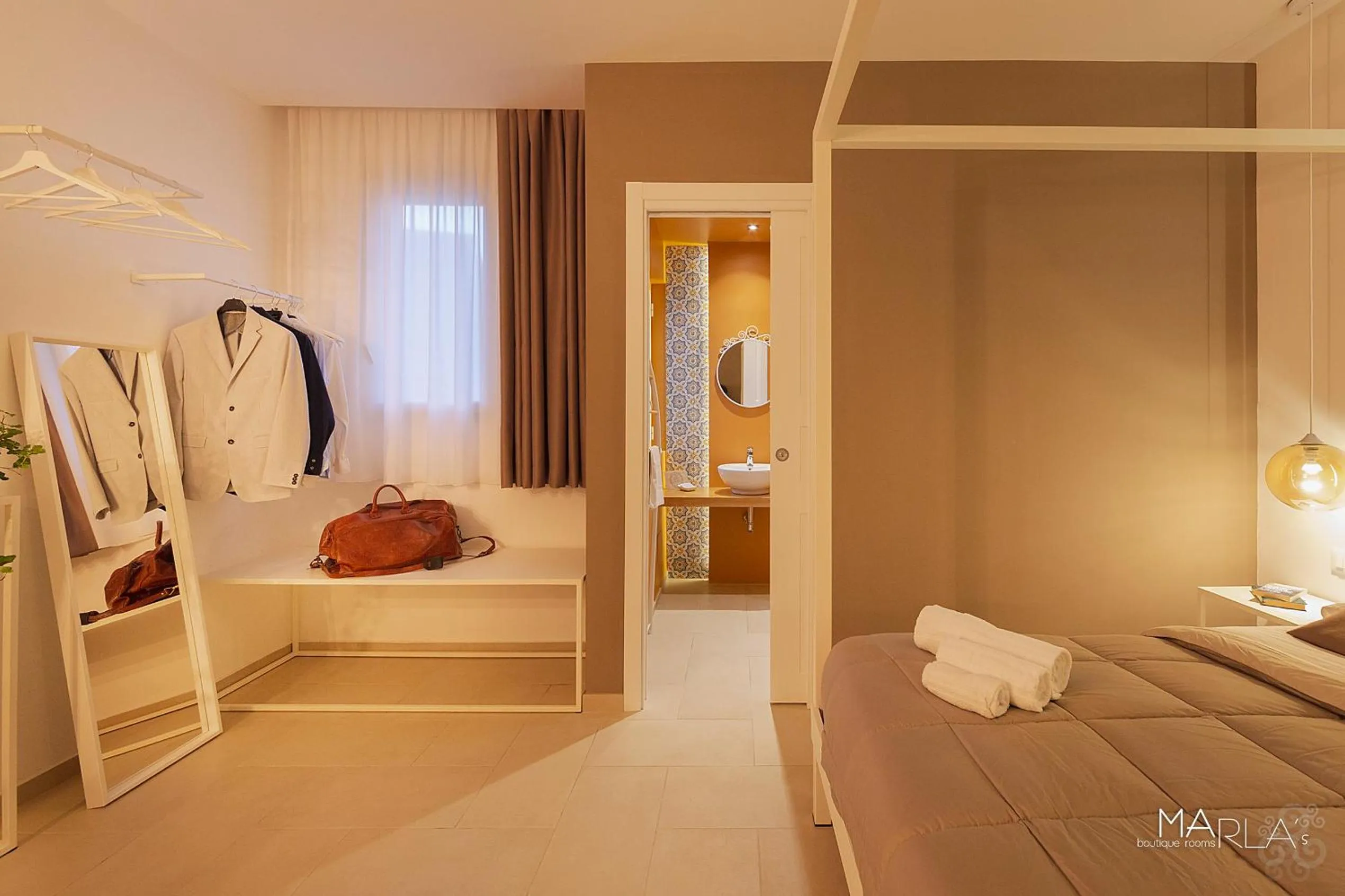 Photo of the whole room, Bed in Marla's boutique rooms