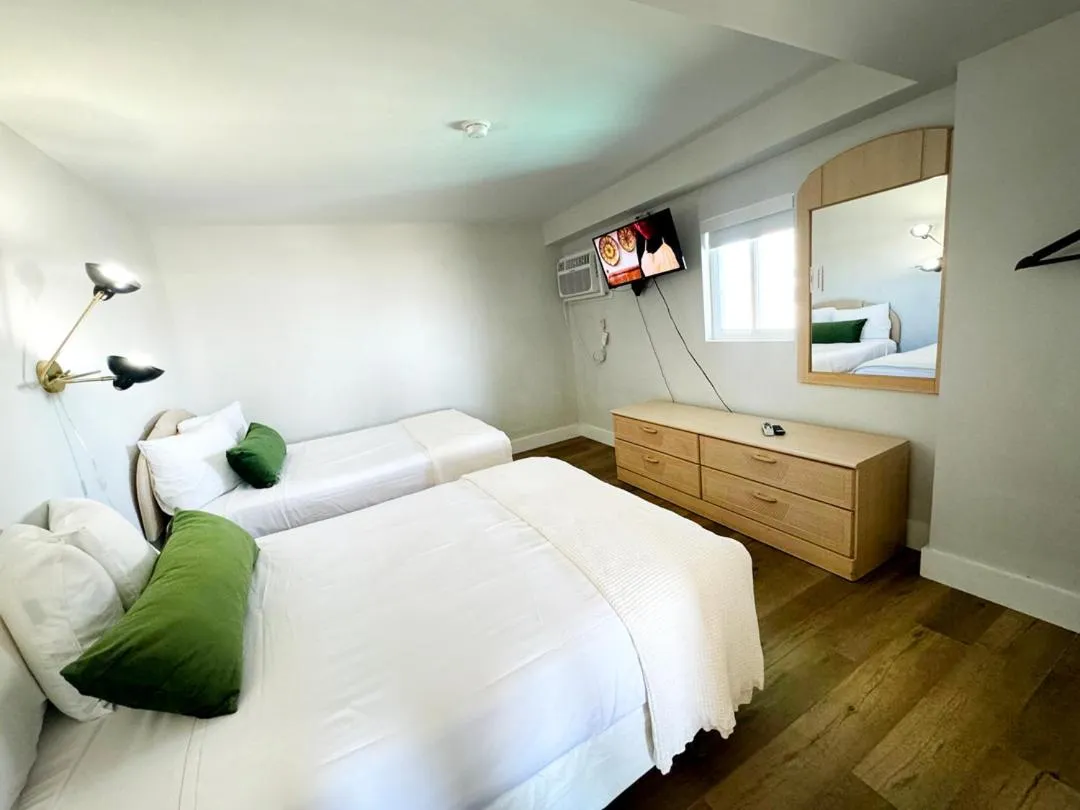 Bed in Coliseum Ocean Resort