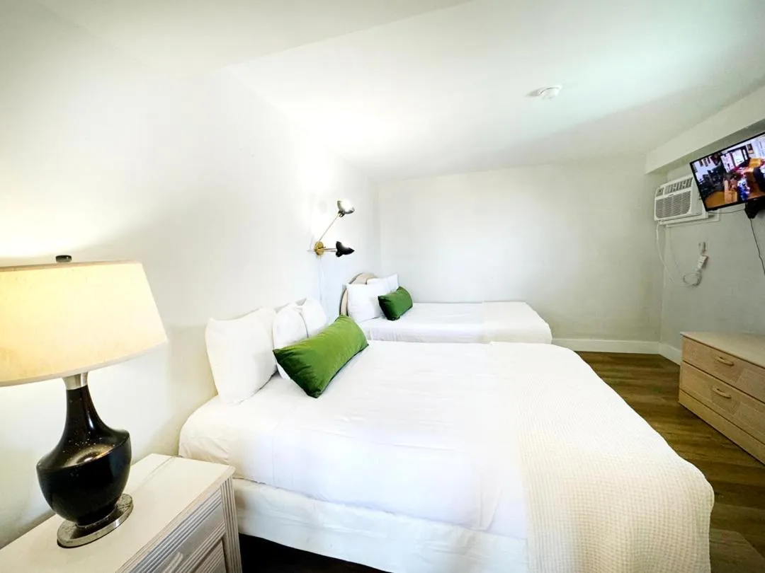 Bed in Coliseum Ocean Resort