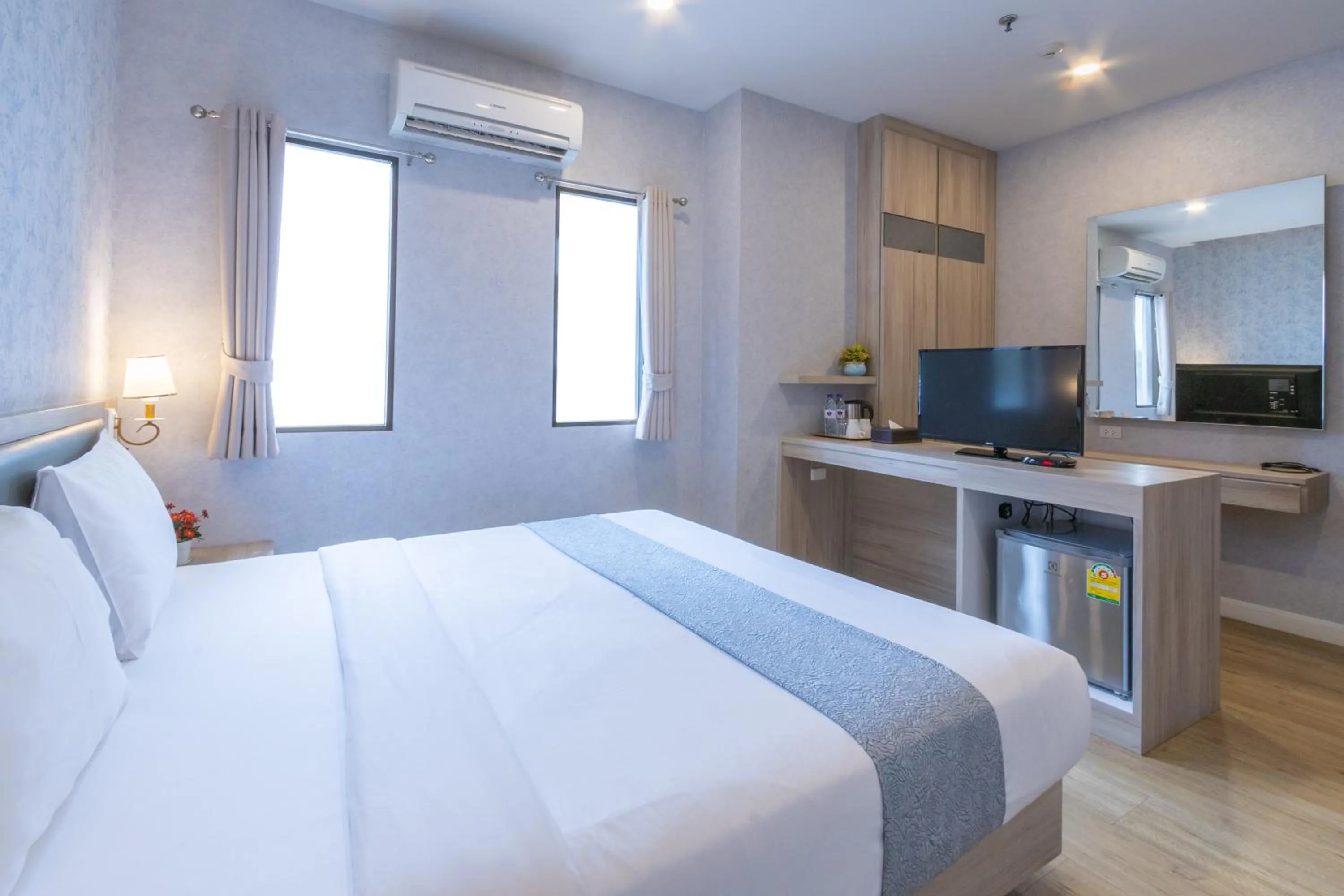 Photo of the whole room, Bed in Leela Orchid Hotel