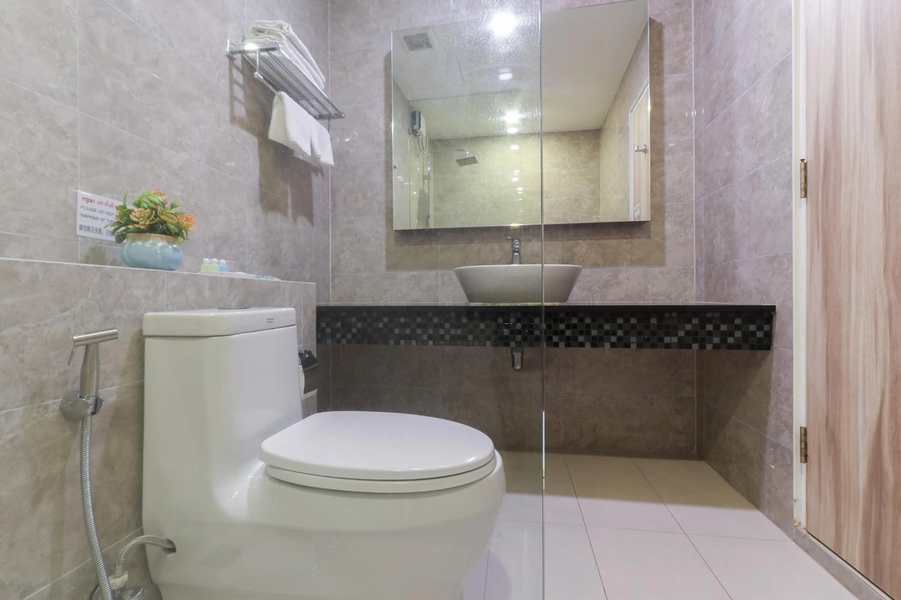 Bathroom in Leela Orchid Hotel