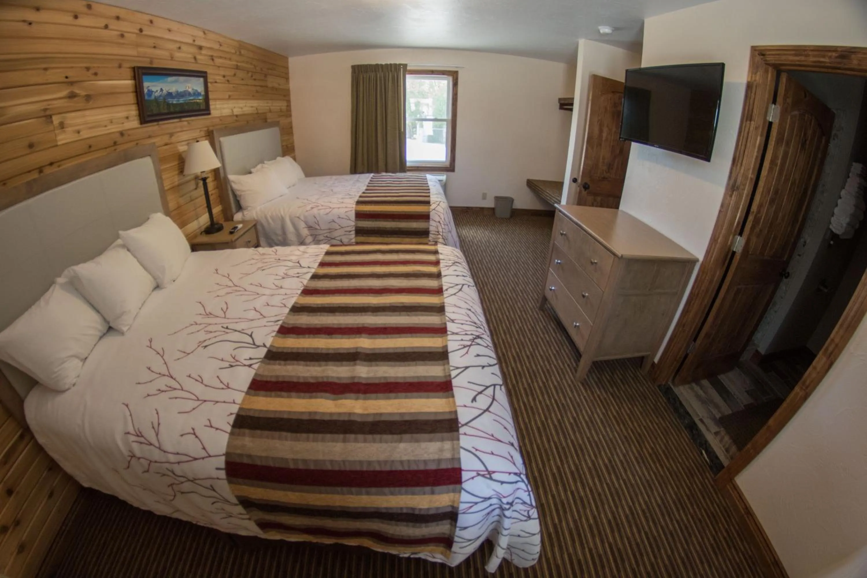 Bedroom, Bed in Stagecoach Inn & Suites