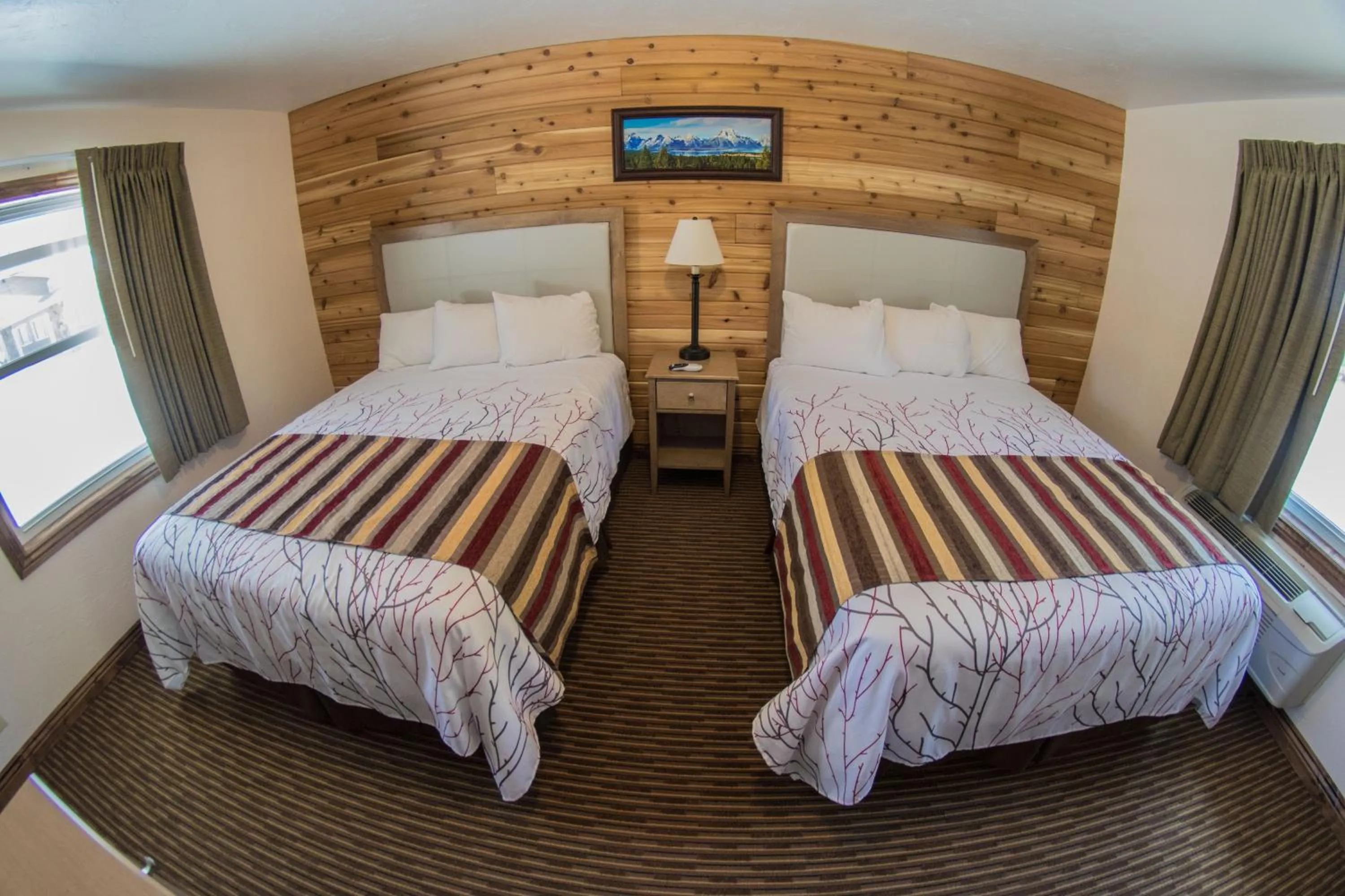 Bed in Stagecoach Inn & Suites