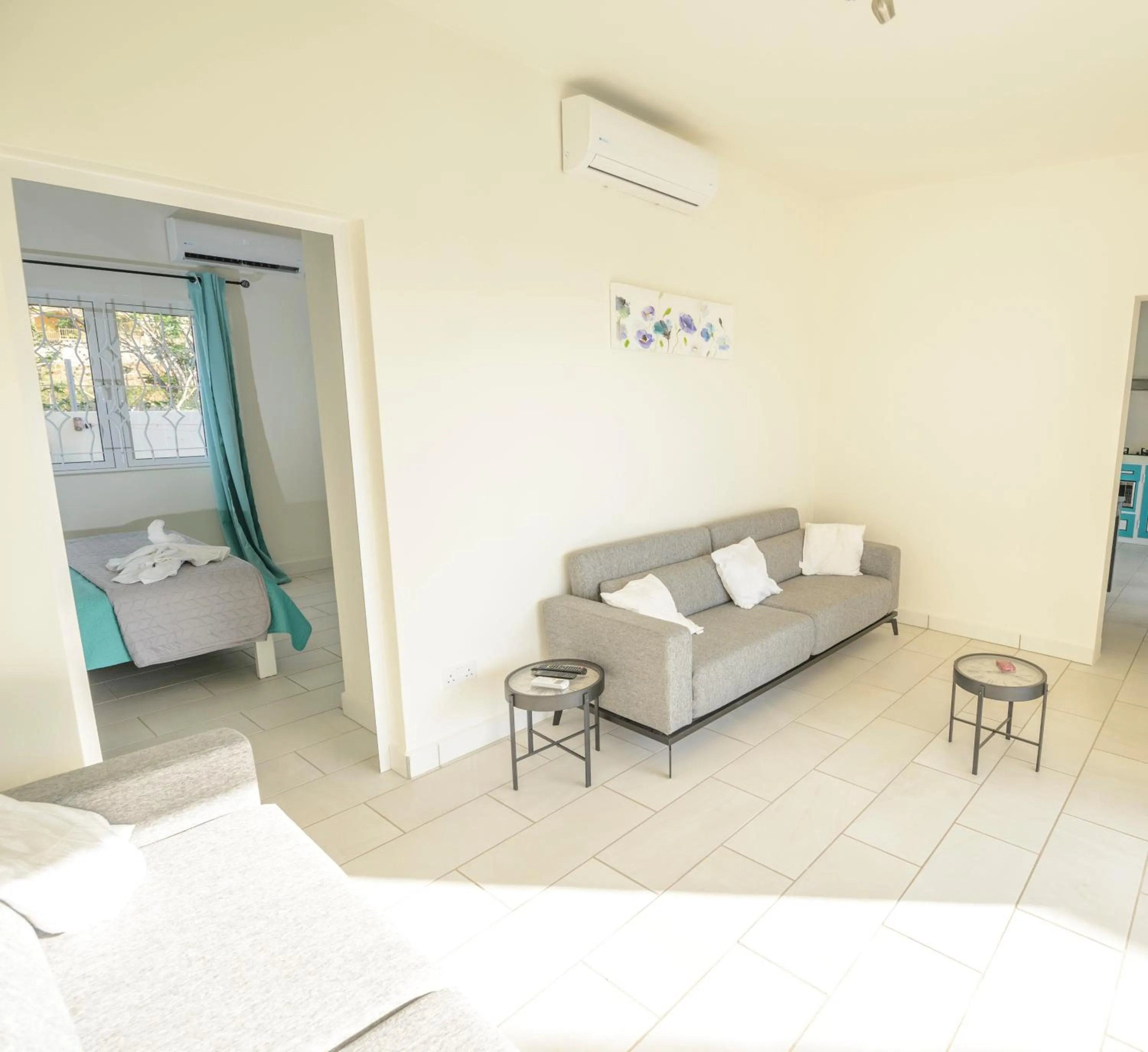 Living room, Bed in Abiki Mauritius with Tourism Authority Permit