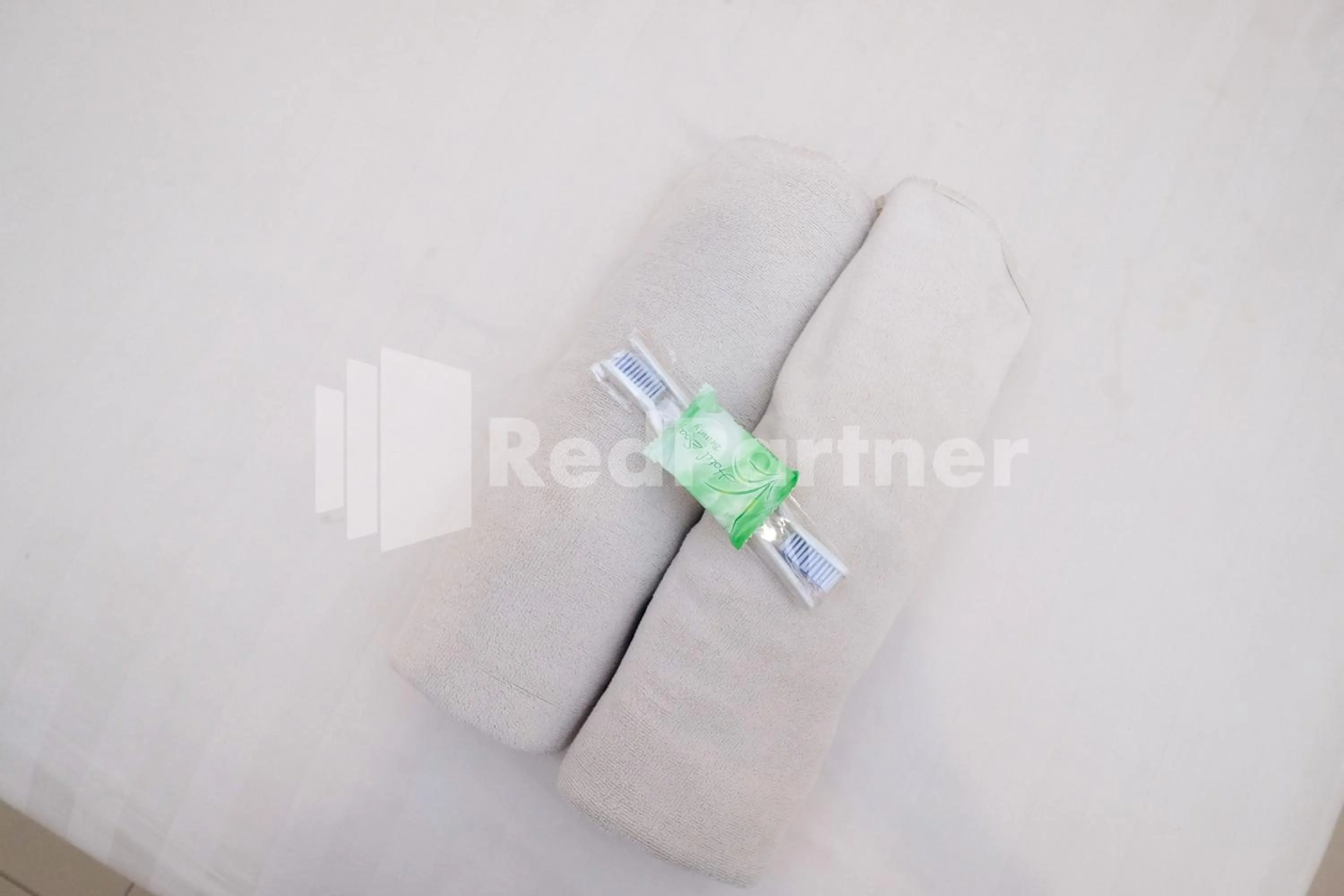 towels in Garuda Guesthouse Yogyakarta RedPartner