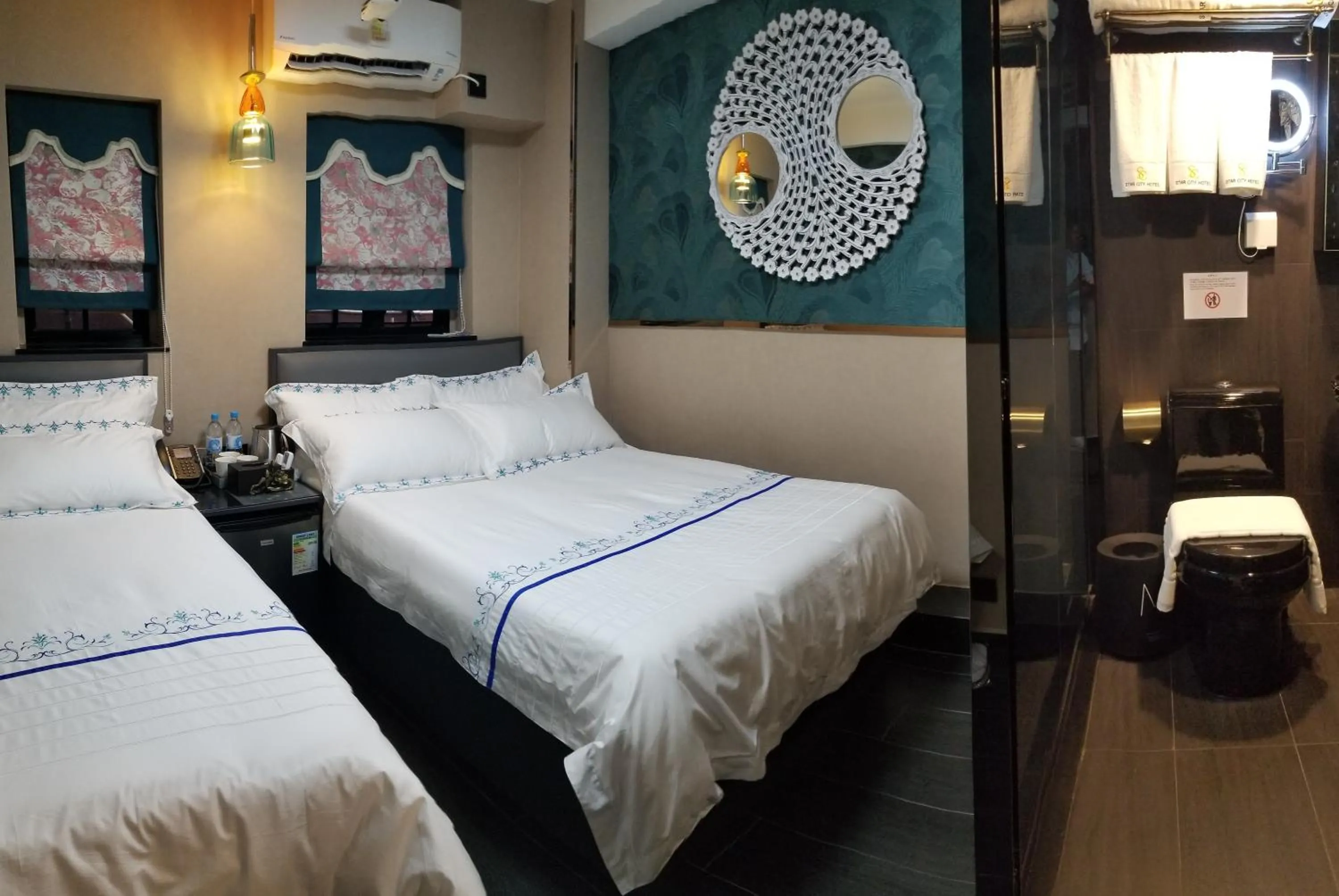 Bed in Star City Hotel