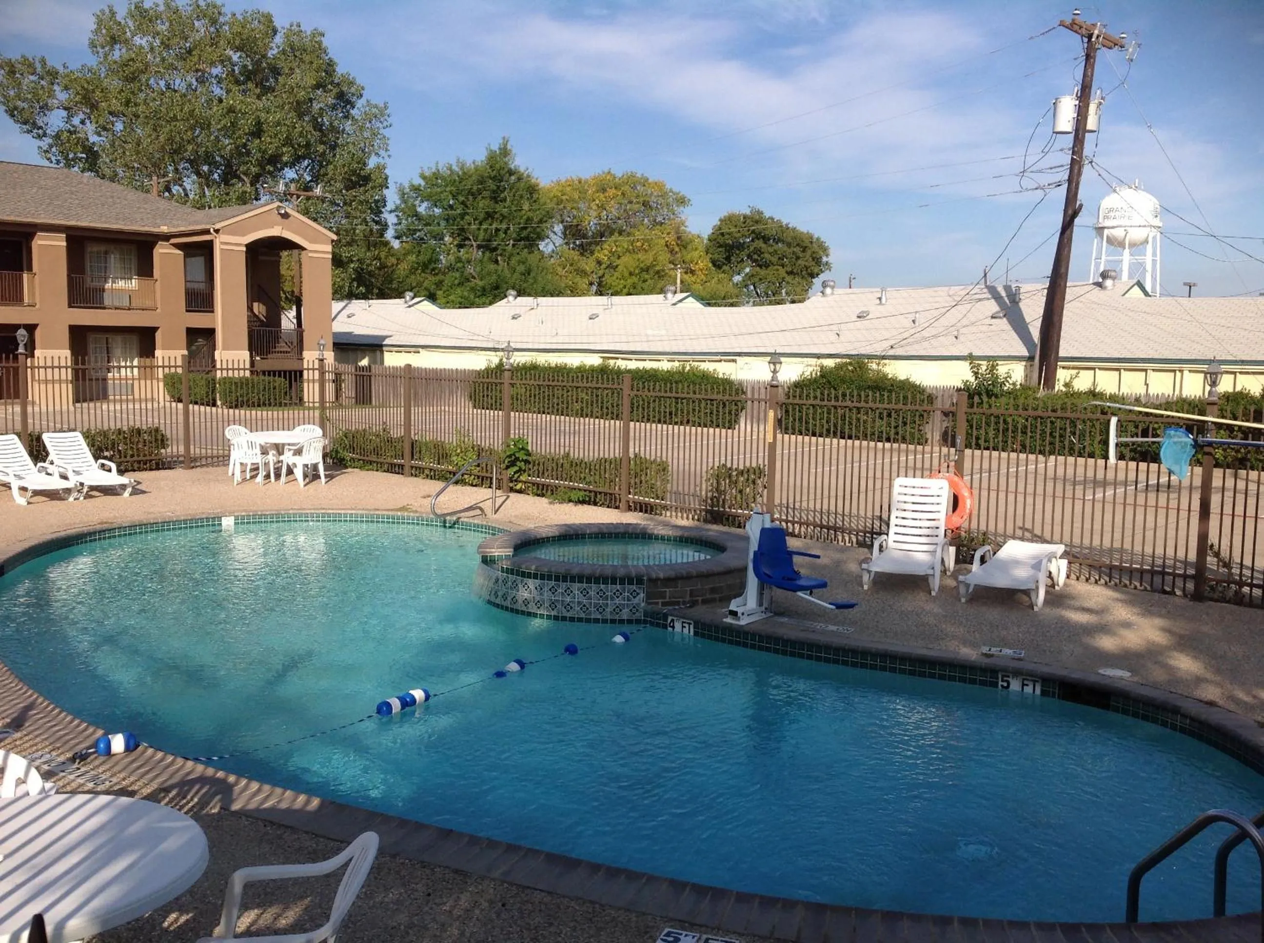 Swimming pool in Howard Johnson by Wyndham Grand Prairie Near Lone Star Park