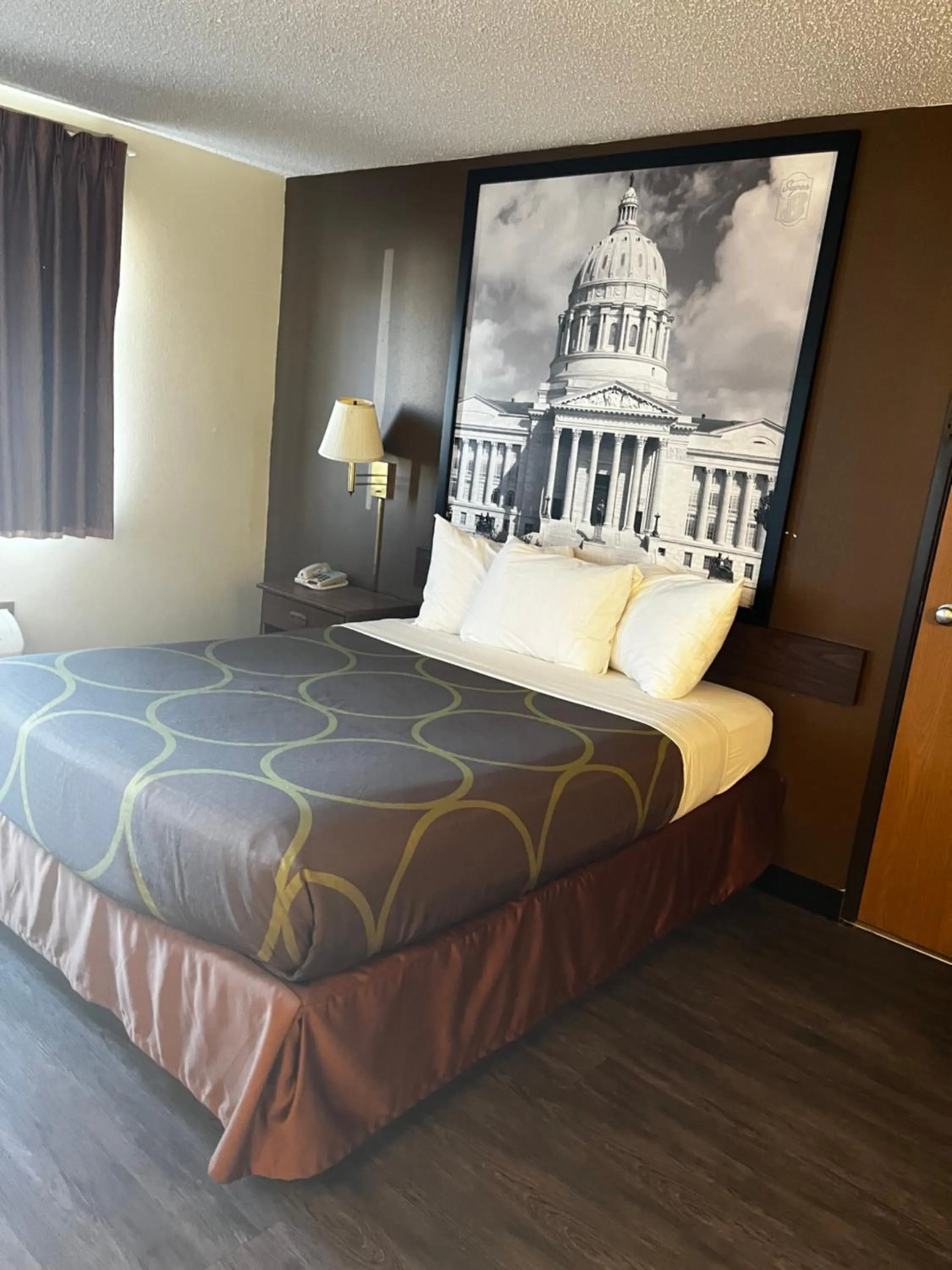 Bed in Super 8 by Wyndham Smithville Kansas City