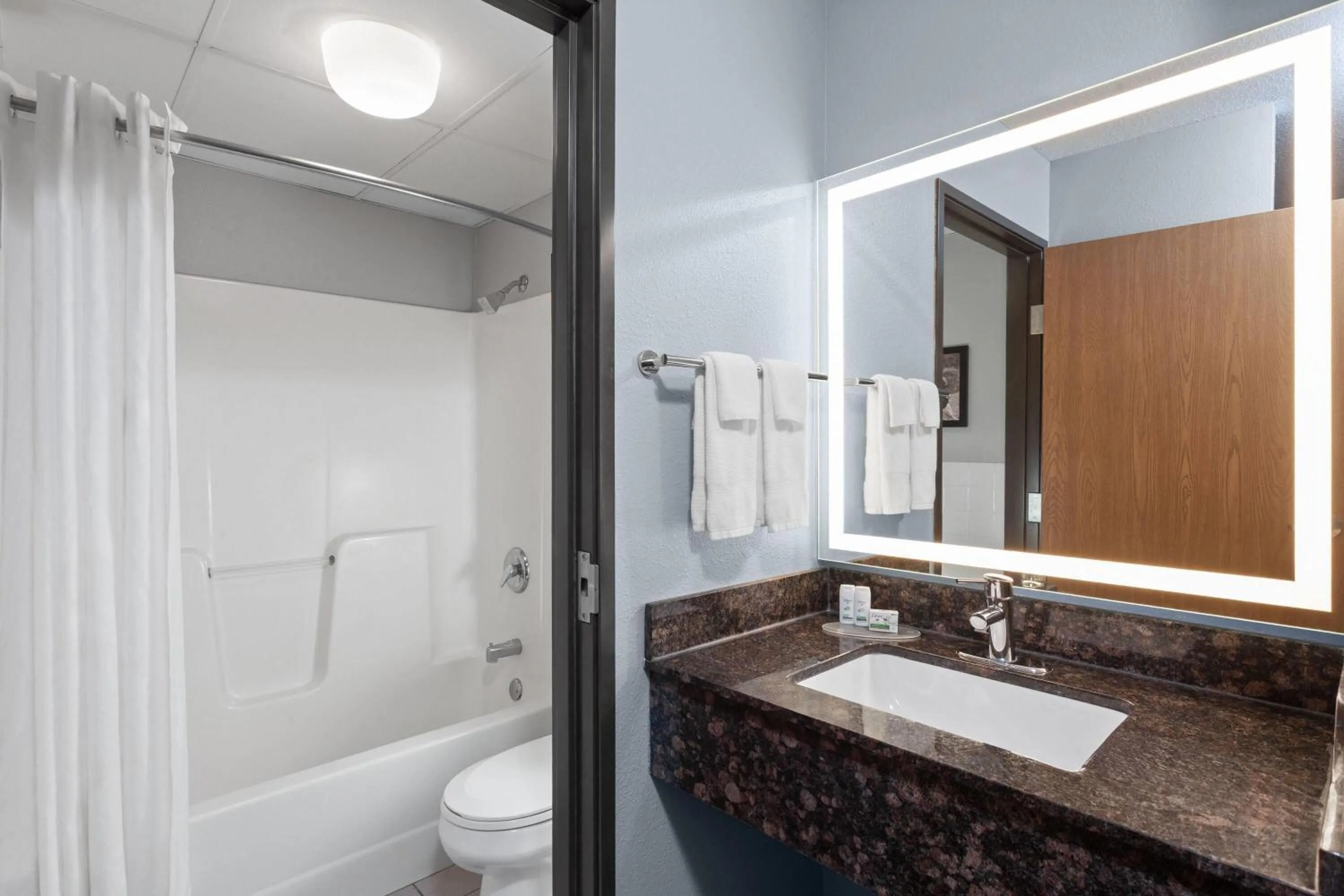 Bathroom in AmericInn by Wyndham West Salem