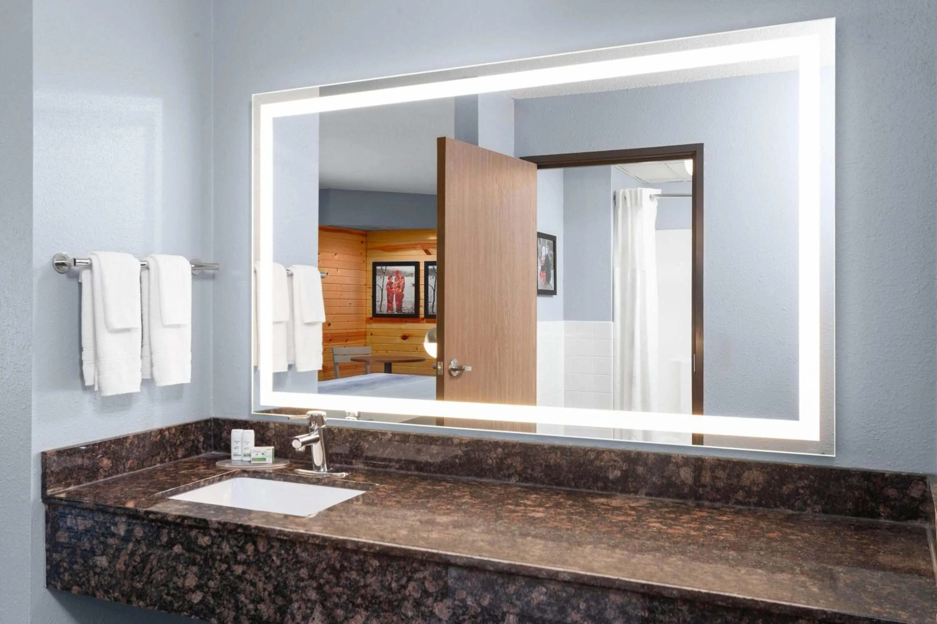 Bathroom in AmericInn by Wyndham West Salem