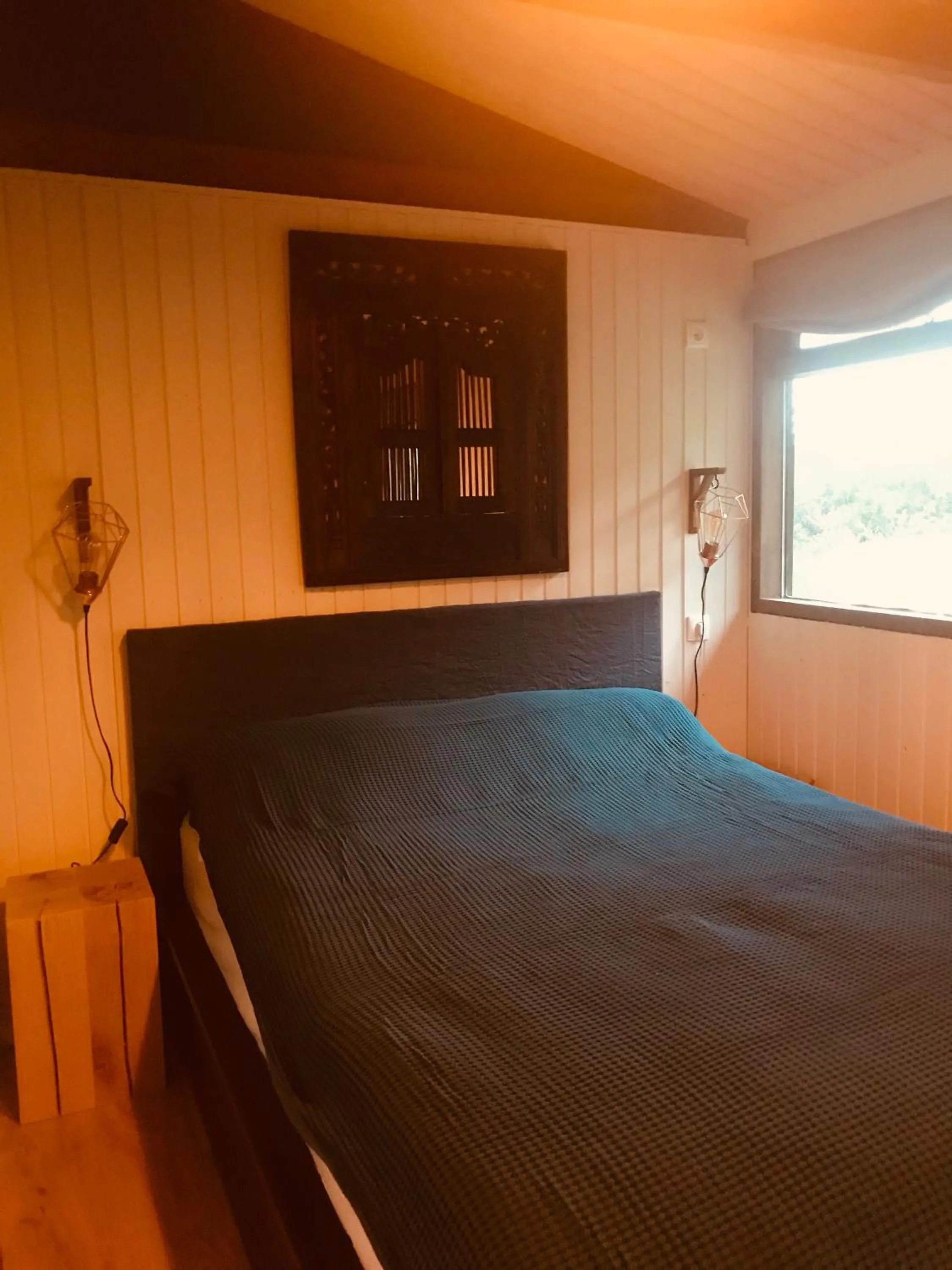 Bed in Mulakot Cosy Cabins