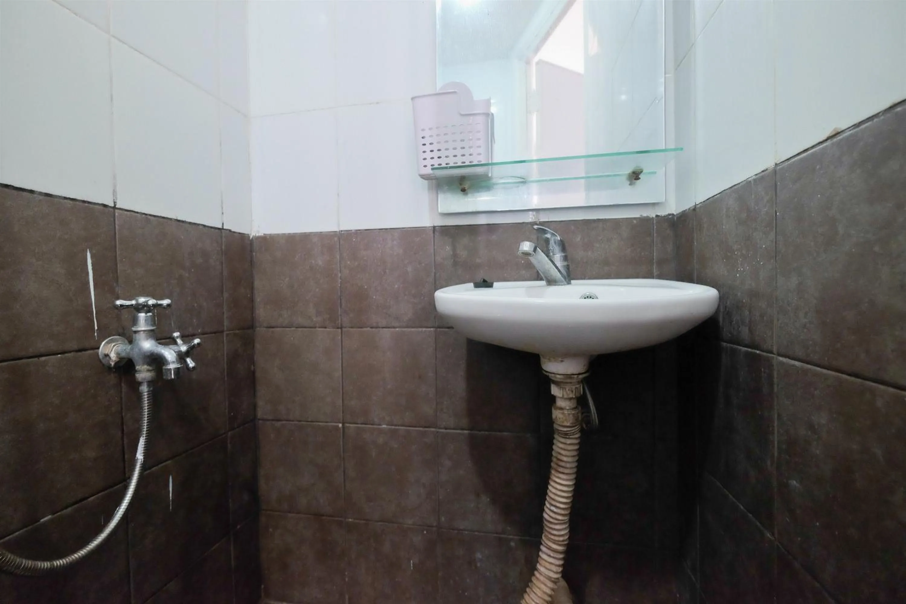 Homey and Relaxing 2BR Green Pramuka City Apartment By Travelio