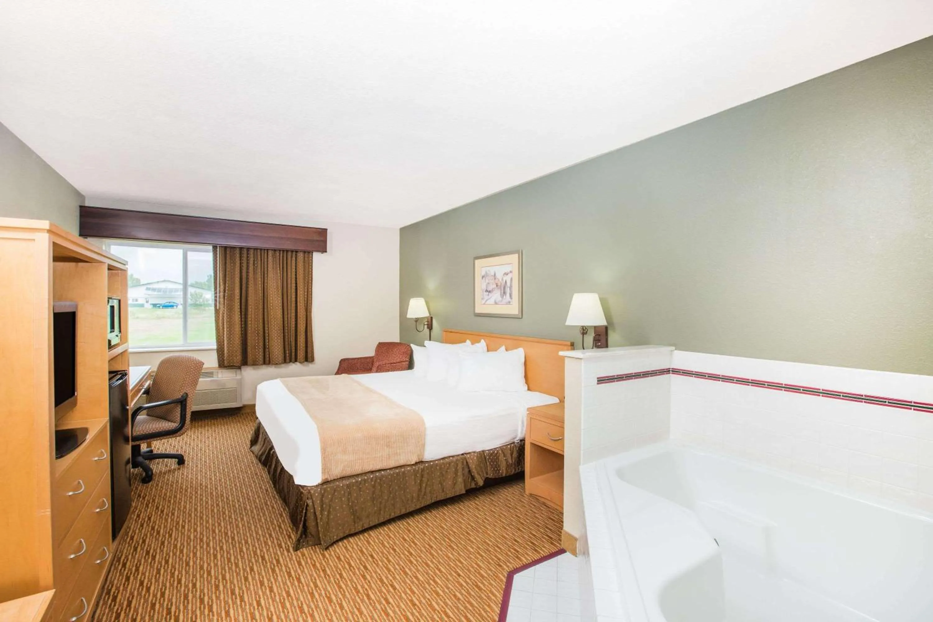 Bed in Ramada by Wyndham Spirit Lake/Okoboji