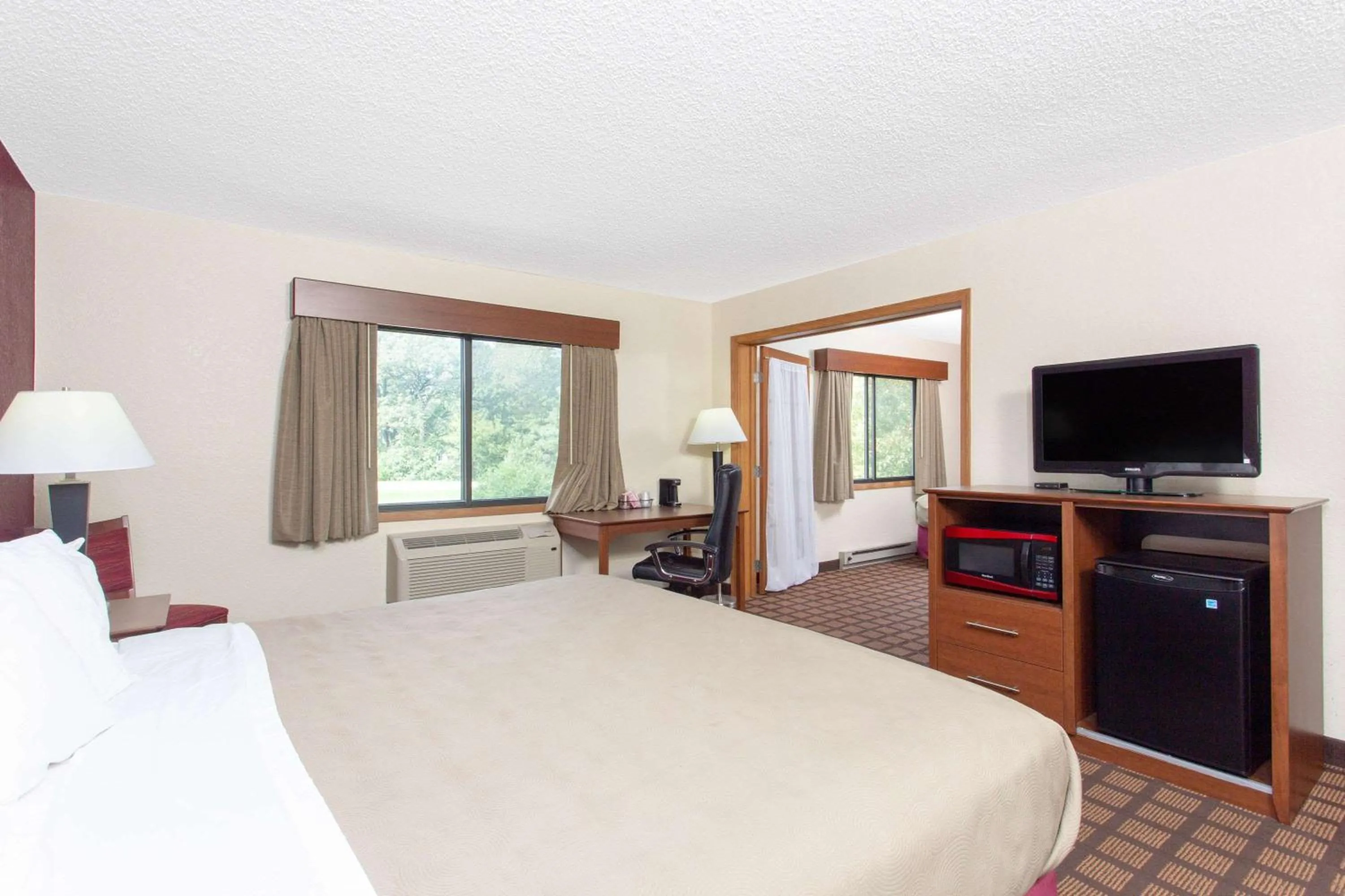 Photo of the whole room, Bed in AmericInn by Wyndham Burlington