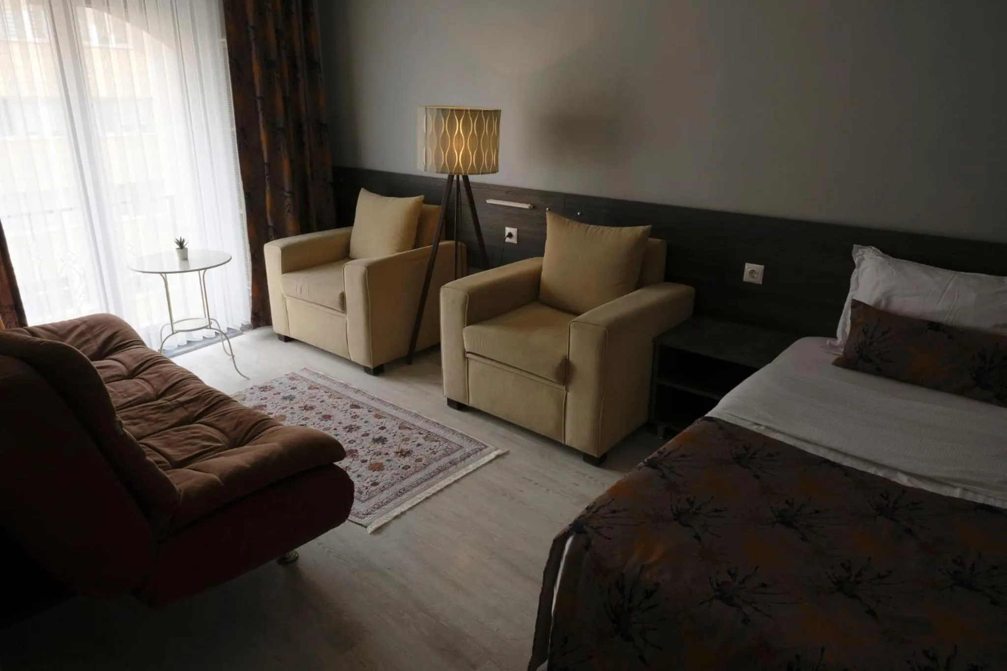 Seating area, Bed in The Breeze Hotel