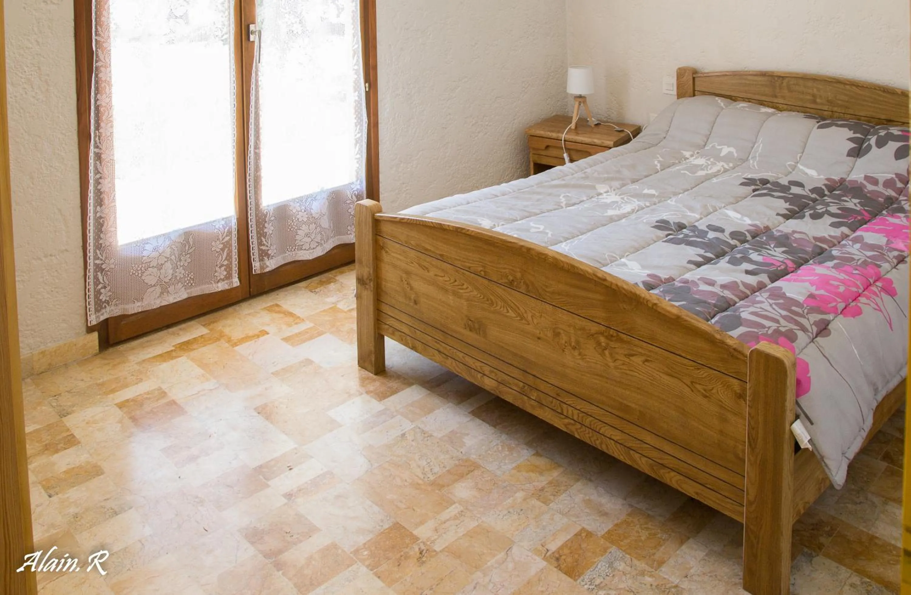 Bed in PARADISE CHALLETS AND CAMPING