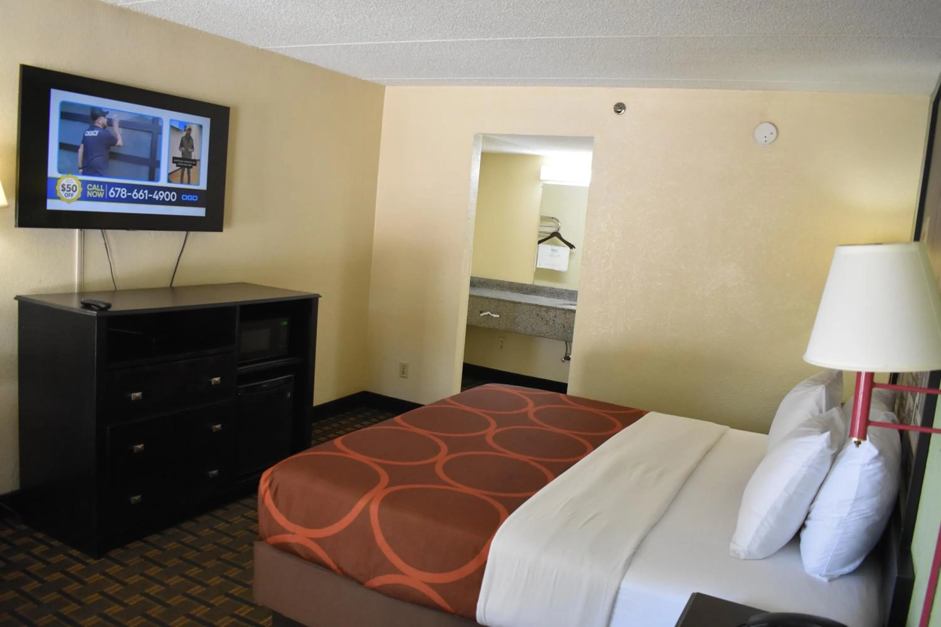 Bed in Super 8 by Wyndham Lithonia